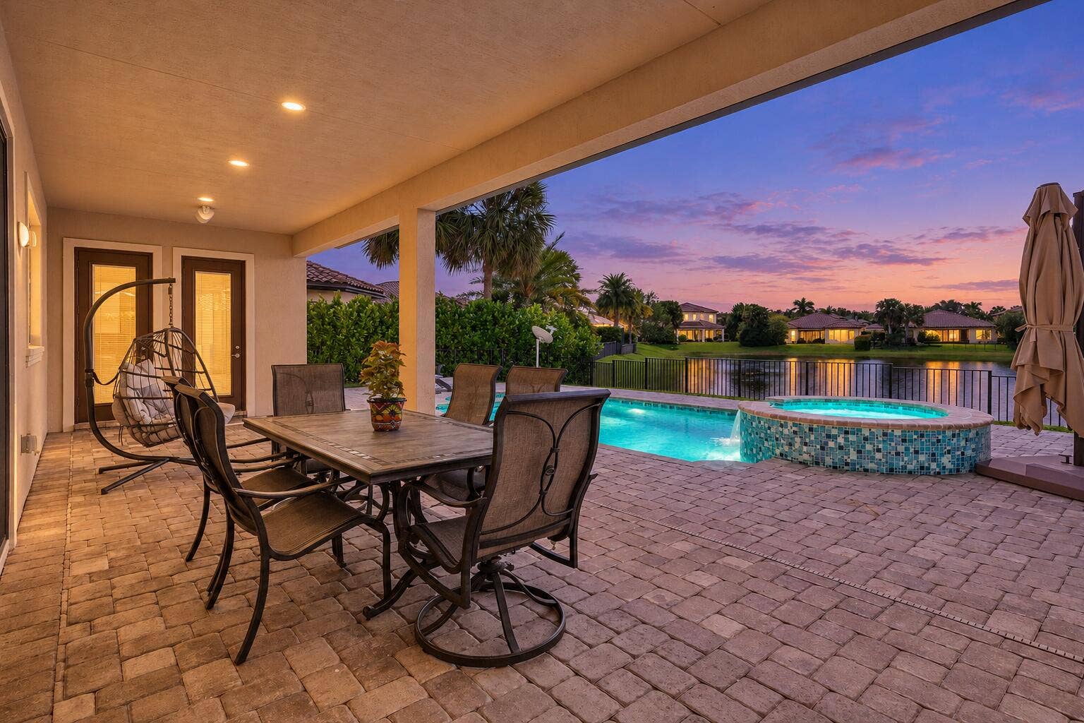 Twilight home with glowing pool-2