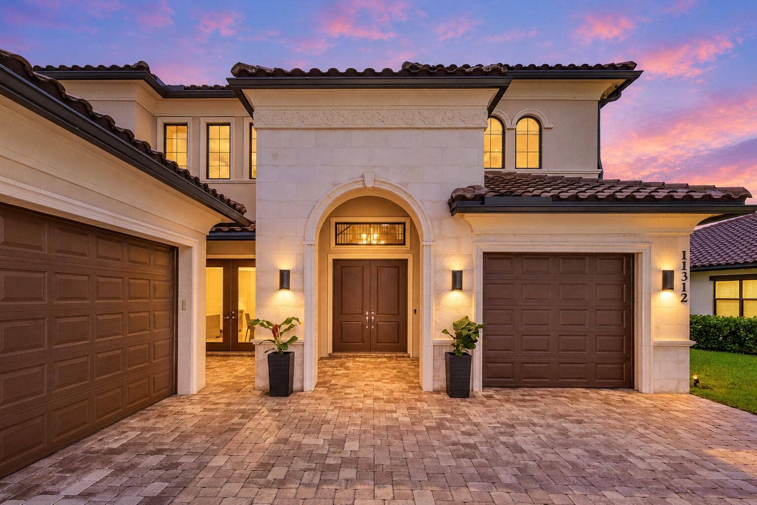 Warmly lit home at twilight