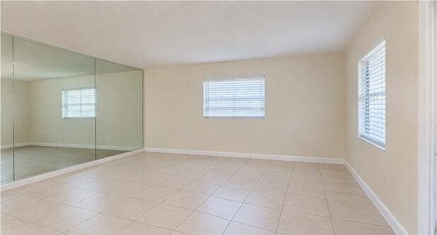 227 CASTLEWOOD Drive, #207, North Palm Beach, FL 33408 10_living_room_mirrored_wall