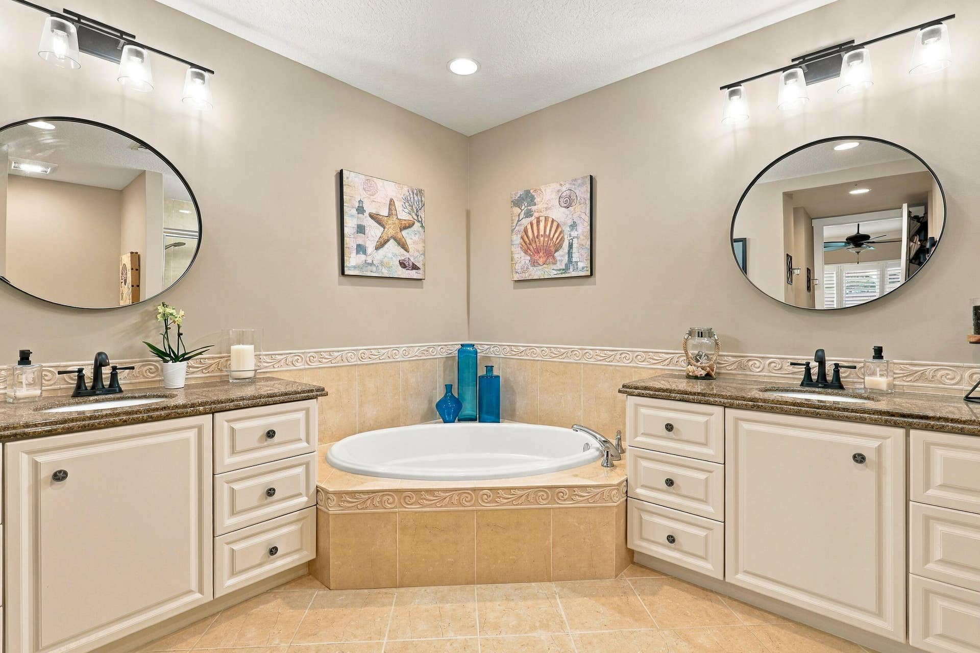 Updated Mirrors, Lighting, and Fixtures in Primary Bath