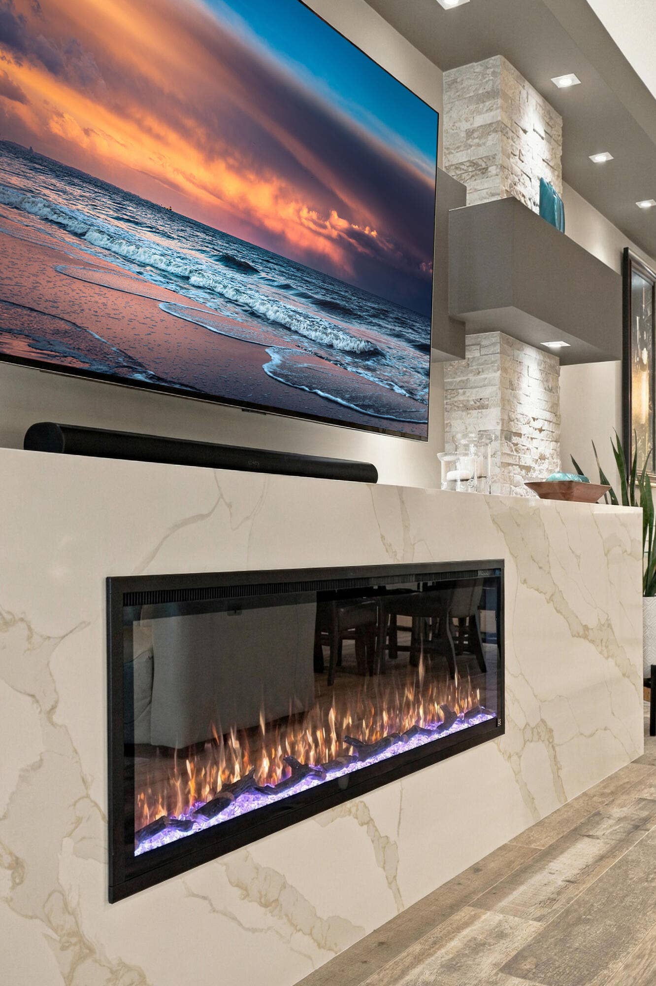 Custom 11 Waterfall Edge Quartz and 5' Quartz Stacking Stone Chimney Style Fireplace Surround, Multiple Bump-out Entertainment Wall with 13 LED Spotlights & Rope Light on Top