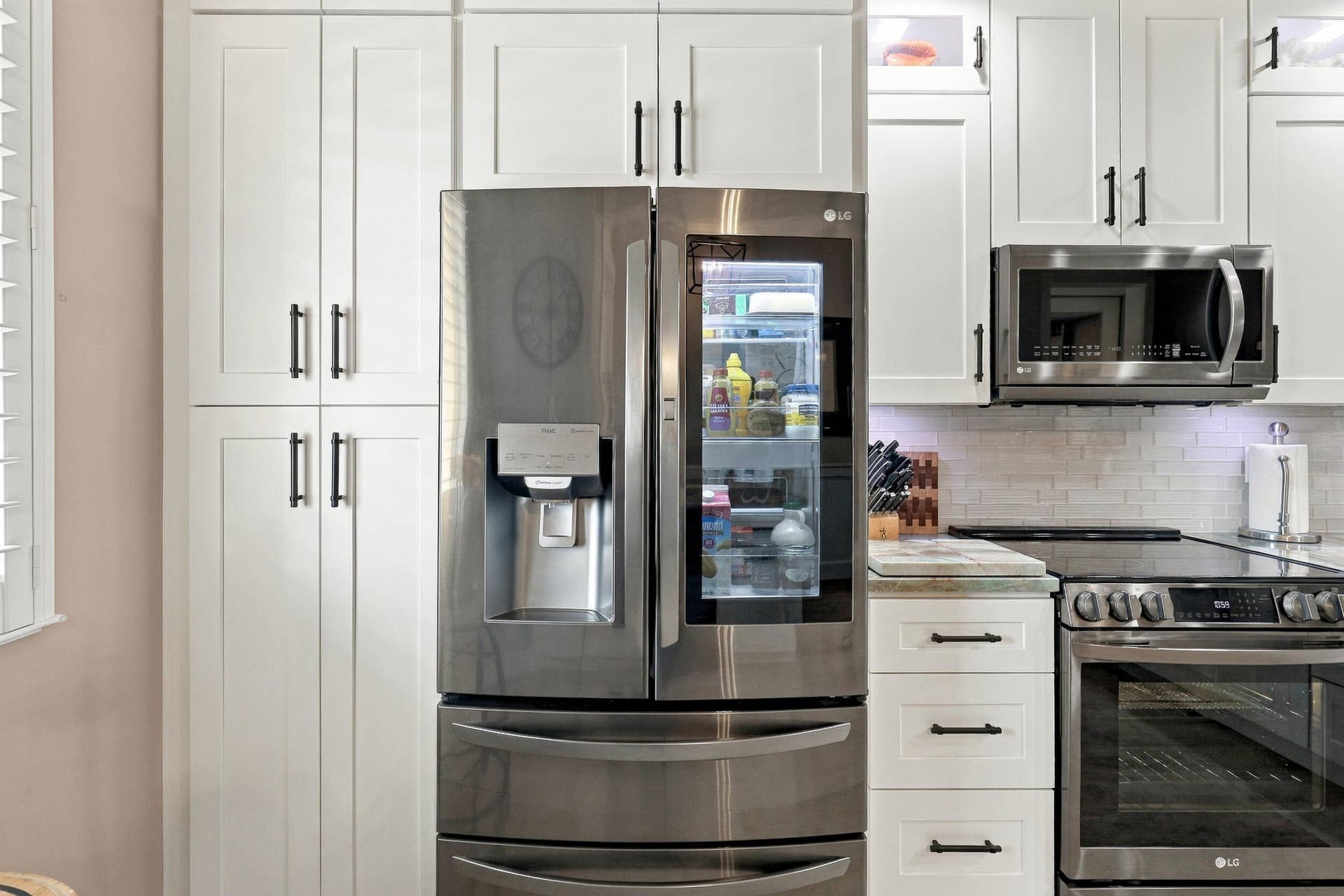 LG Black Stainless Instaview Refrigerator - Print Proof Black Stainless Steel with French Door Top and Two-Pull Out Drawers, Instaview Door in Door (Knock twice on the glass panel to light up the interior) without opening the door, ThinQ Technology that connects with the LG ThinQ app for smart diagnostics, maintenance alerts, and energy monitoring.