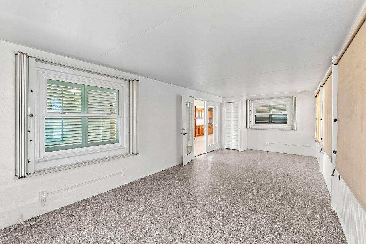 1707 SW 18th Street, Boynton Beach, FL 33426 Huge enclosed back patio with portable air conditioner