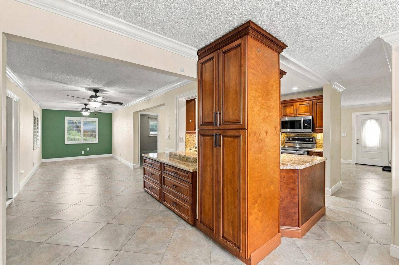 1707 SW 18th Street, Boynton Beach, FL 33426 More cabinets and extra cabinetry adjoining the dining room