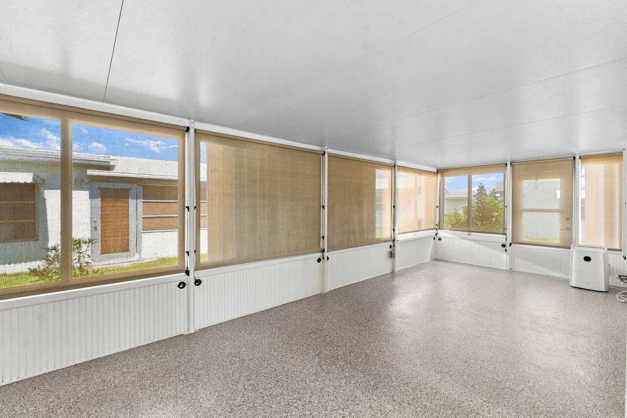 1707 SW 18th Street, Boynton Beach, FL 33426 2026 enclosed back patio with portable air conditioner