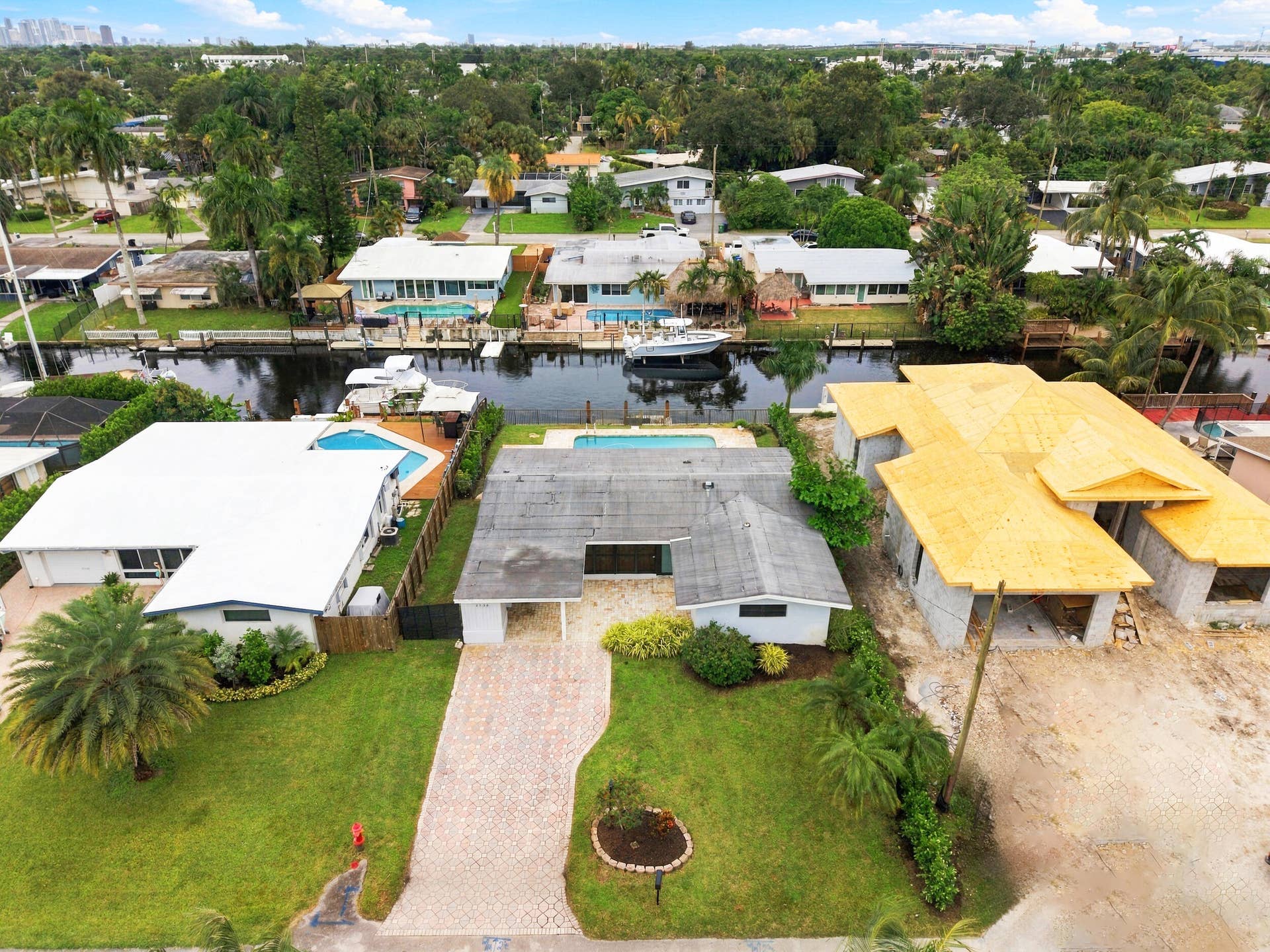 2536 GULFSTREAM Lane, Fort Lauderdale, FL 33312 Waterfront property with private dock, in-ground swimming pool, and a paved driveway