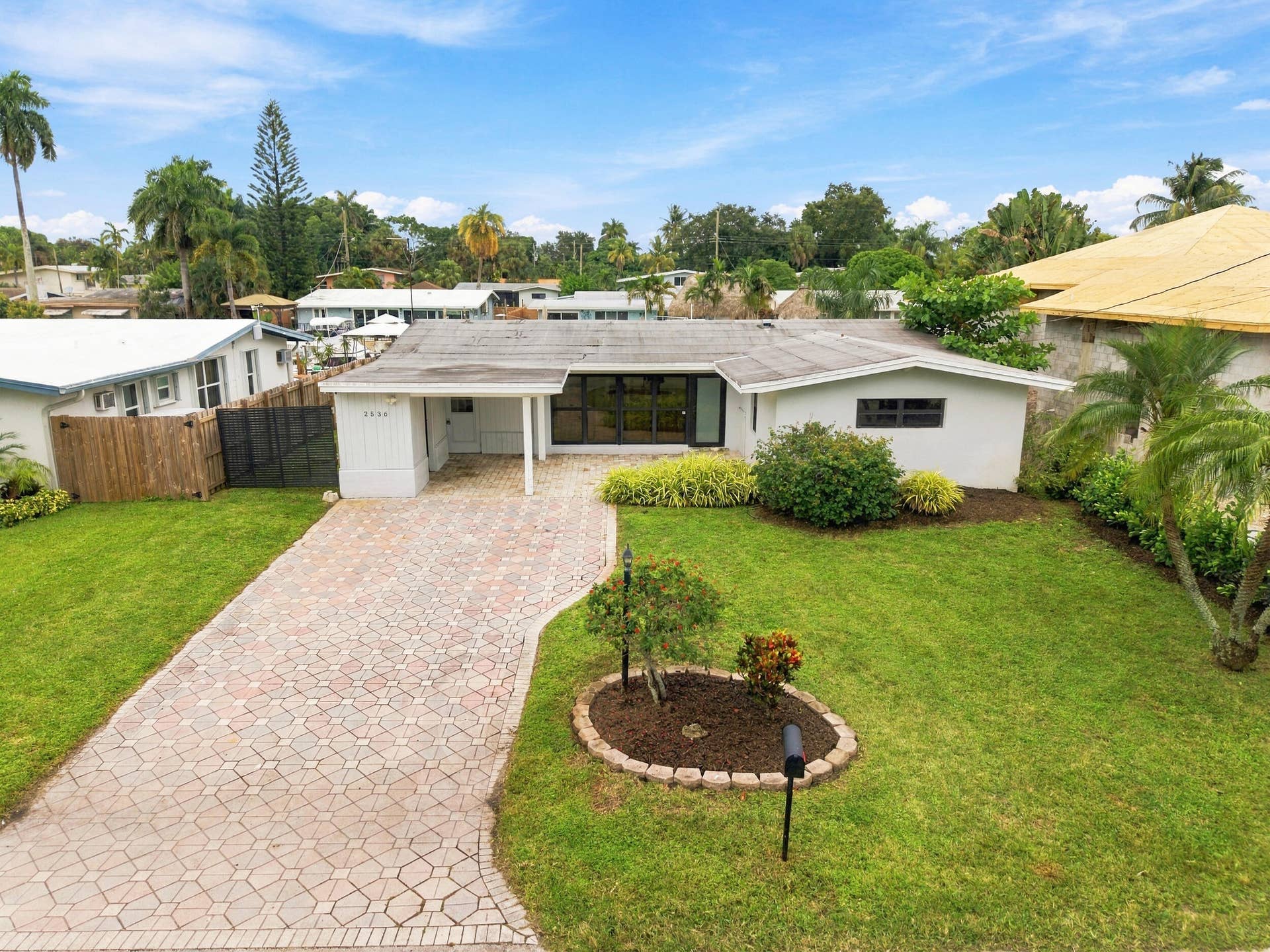 2536 GULFSTREAM Lane, Fort Lauderdale, FL 33312 White stucco exterior with a covered entry