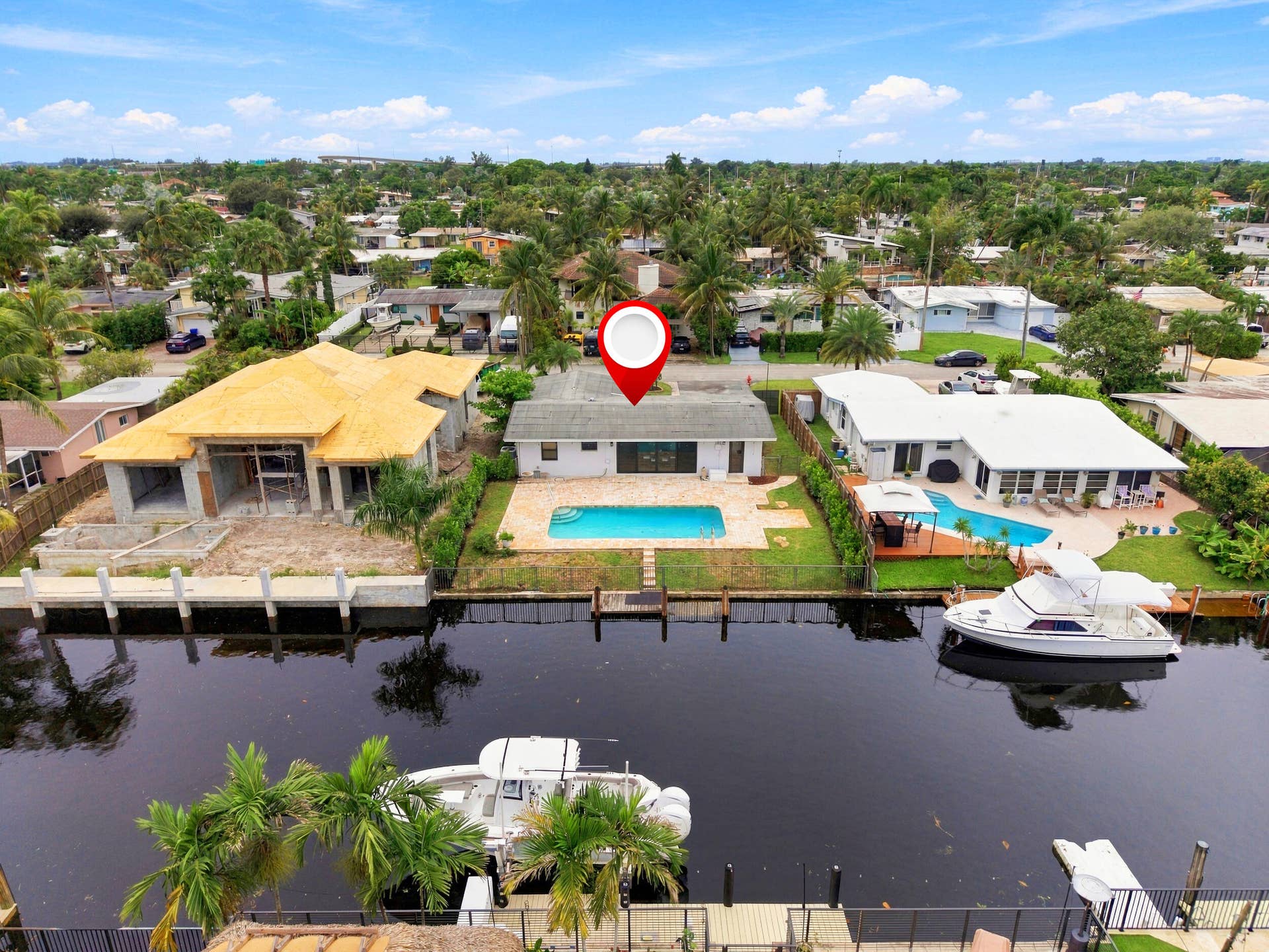 2536 GULFSTREAM Lane, Fort Lauderdale, FL 33312 Waterfront property with private dock access, featuring an in-ground swimming pool and a paved pool deck