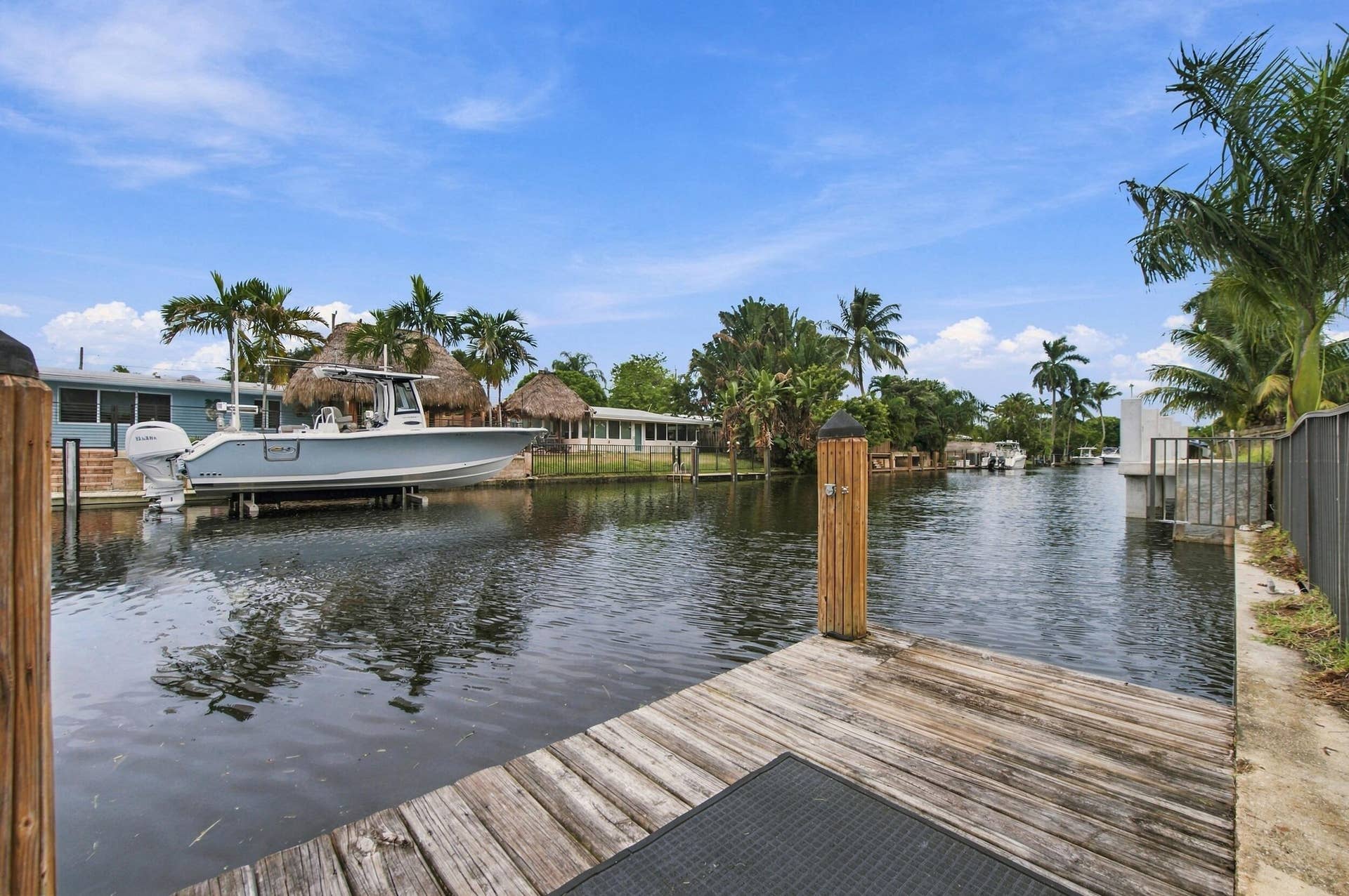 2536 GULFSTREAM Lane, Fort Lauderdale, FL 33312 Waterfront property featuring a wood dock and boat lift
