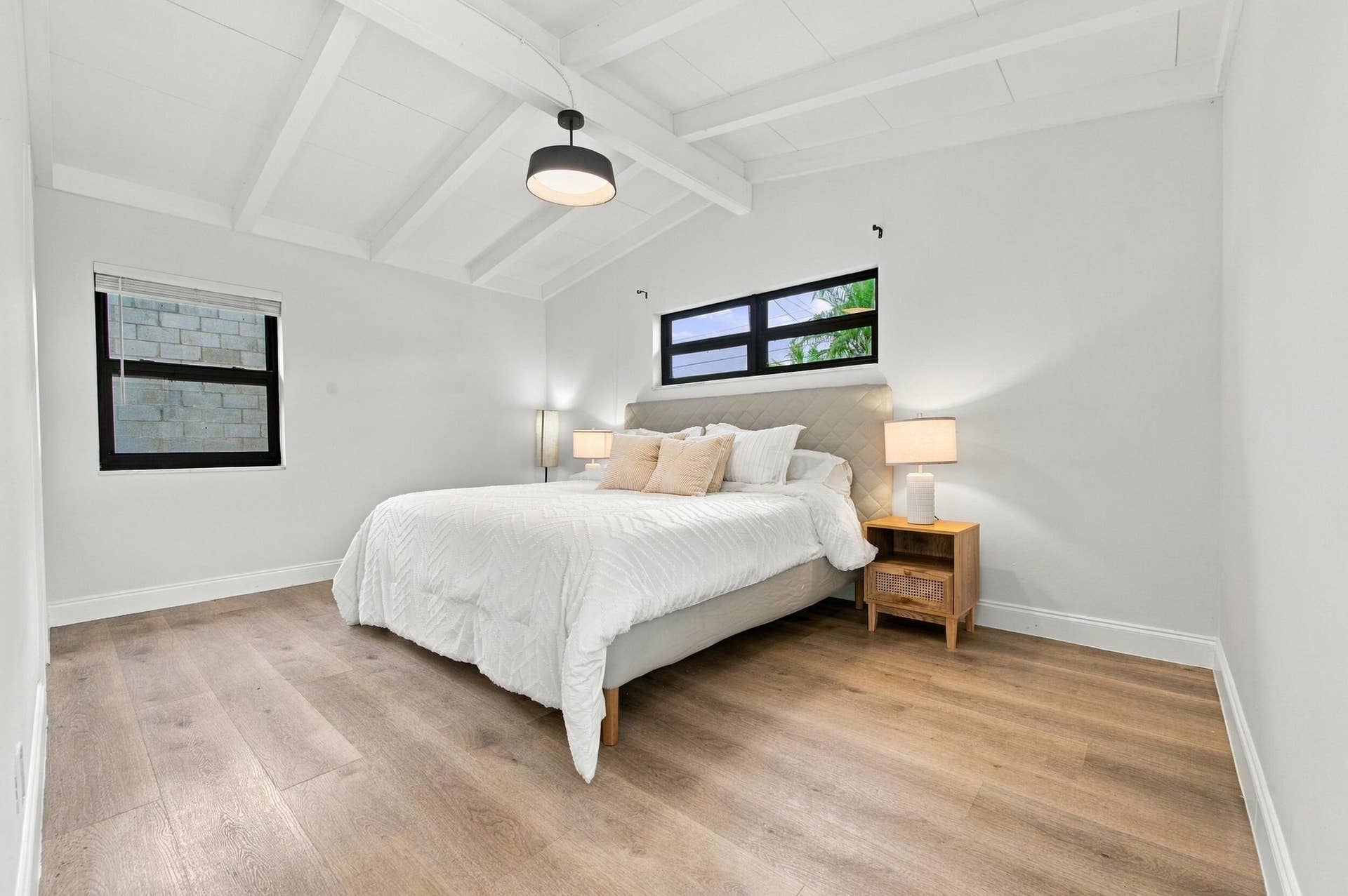 2536 GULFSTREAM Lane, Fort Lauderdale, FL 33312 Vaulted ceiling with exposed beams, wood-finish flooring, recessed window, and a built-in overhead light fixture