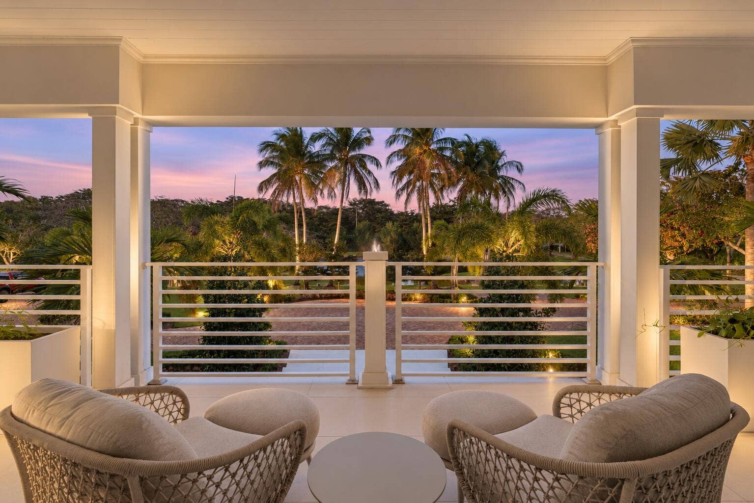 13920 Stirling Road, Southwest Ranches, FL 33330 Twilight Porch with Palm-Lined Pond