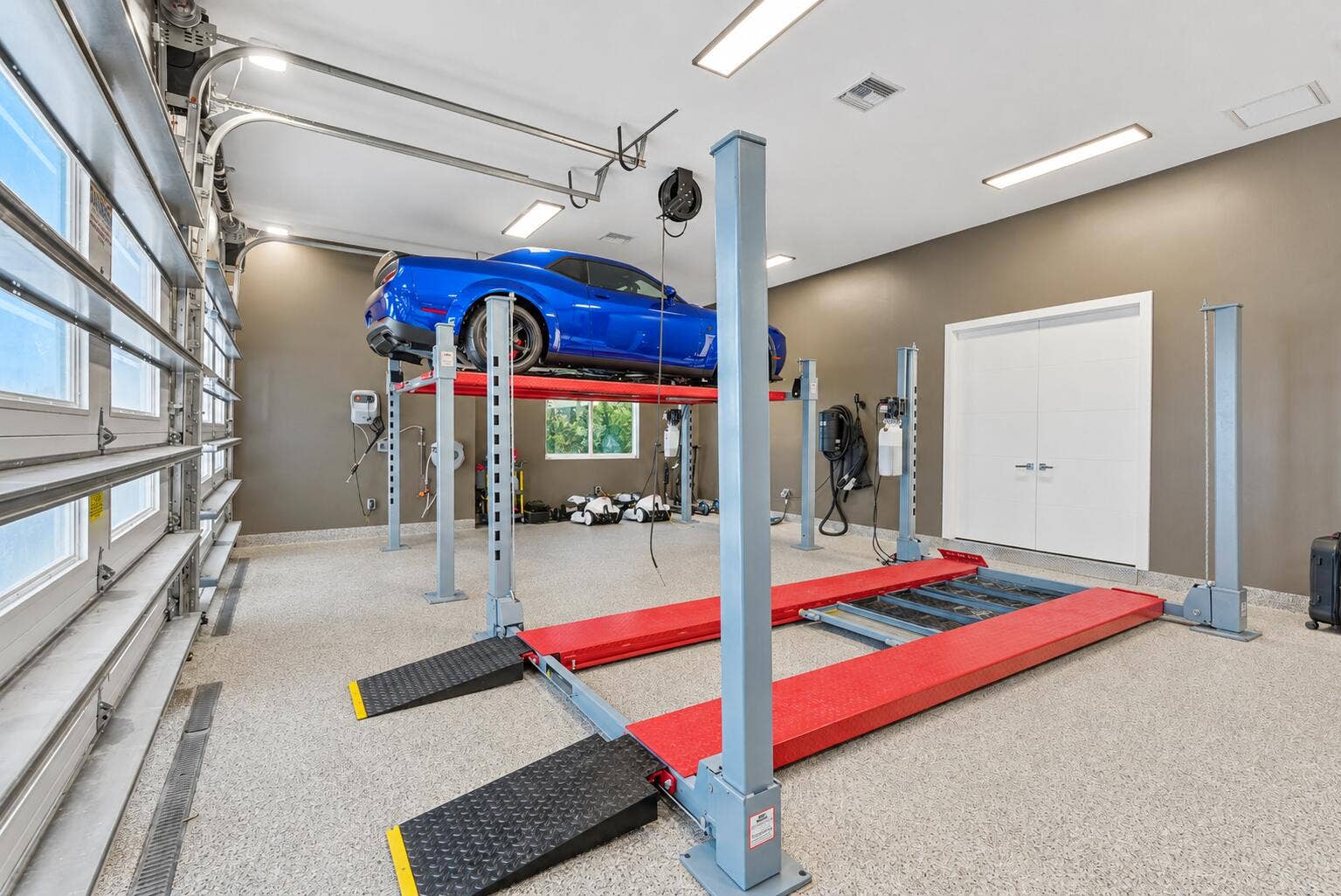 13920 Stirling Road, Southwest Ranches, FL 33330 FOUR CAR GARAGE WITH LIFTS