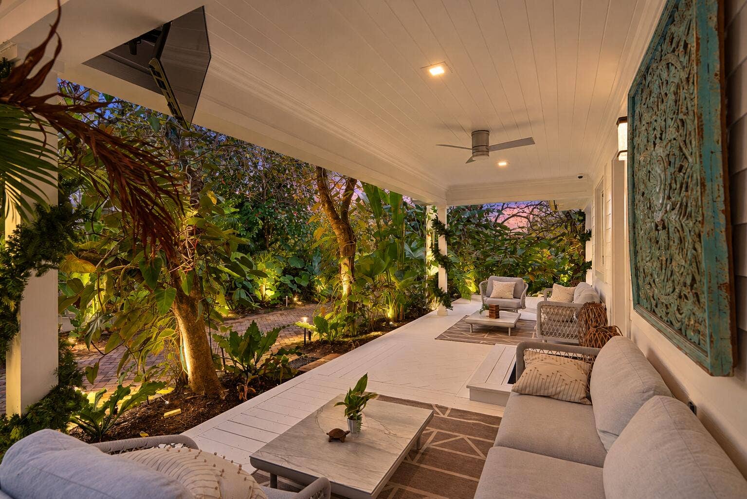 13920 Stirling Road, Southwest Ranches, FL 33330 Twilight luxury porch in tropical garden
