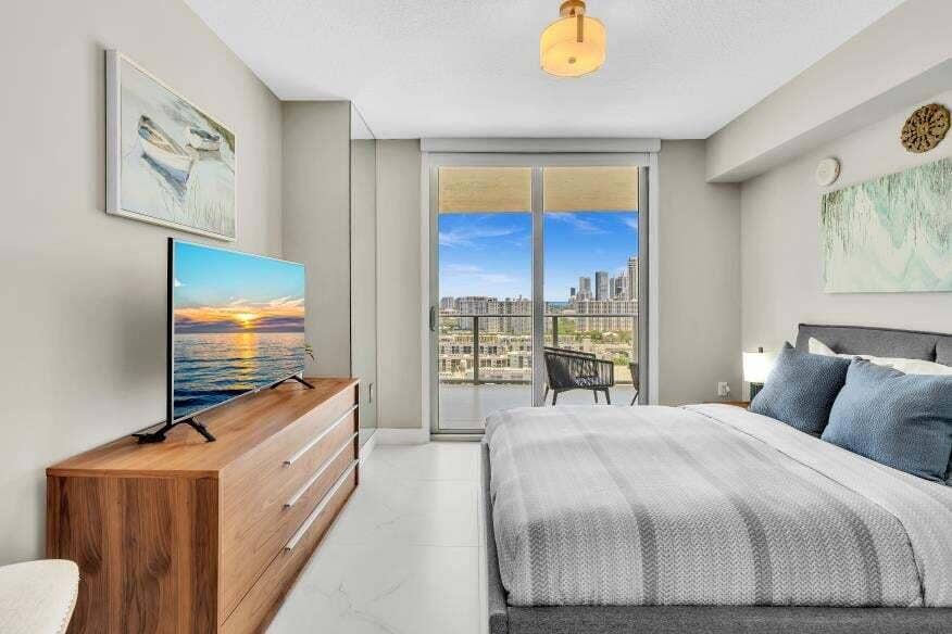 Sunny Isles Beach, Sunny Isles Beach, FL 33160 Floor-to-ceiling sliding glass doors open to a private balcony
