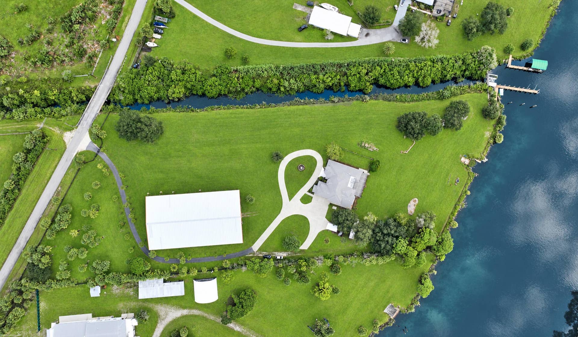 10225 SW Green Ridge Lane, Palm City, FL 34990 Pristine lakeside estate aerial panorama