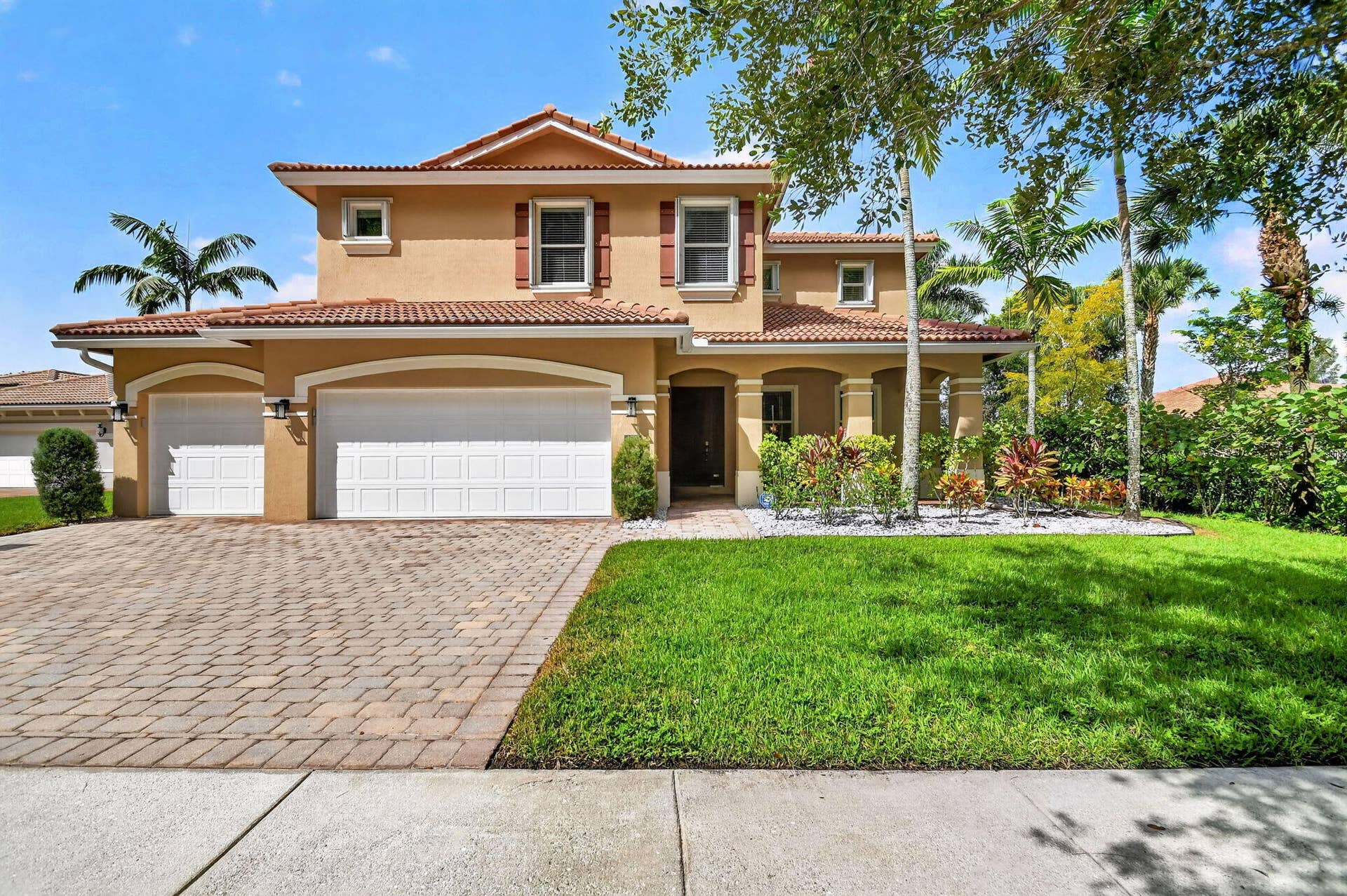 9070 WINTERHAVEN Circle, West Palm Beach, FL 33411 Private, surrounded by lake and preserve views.