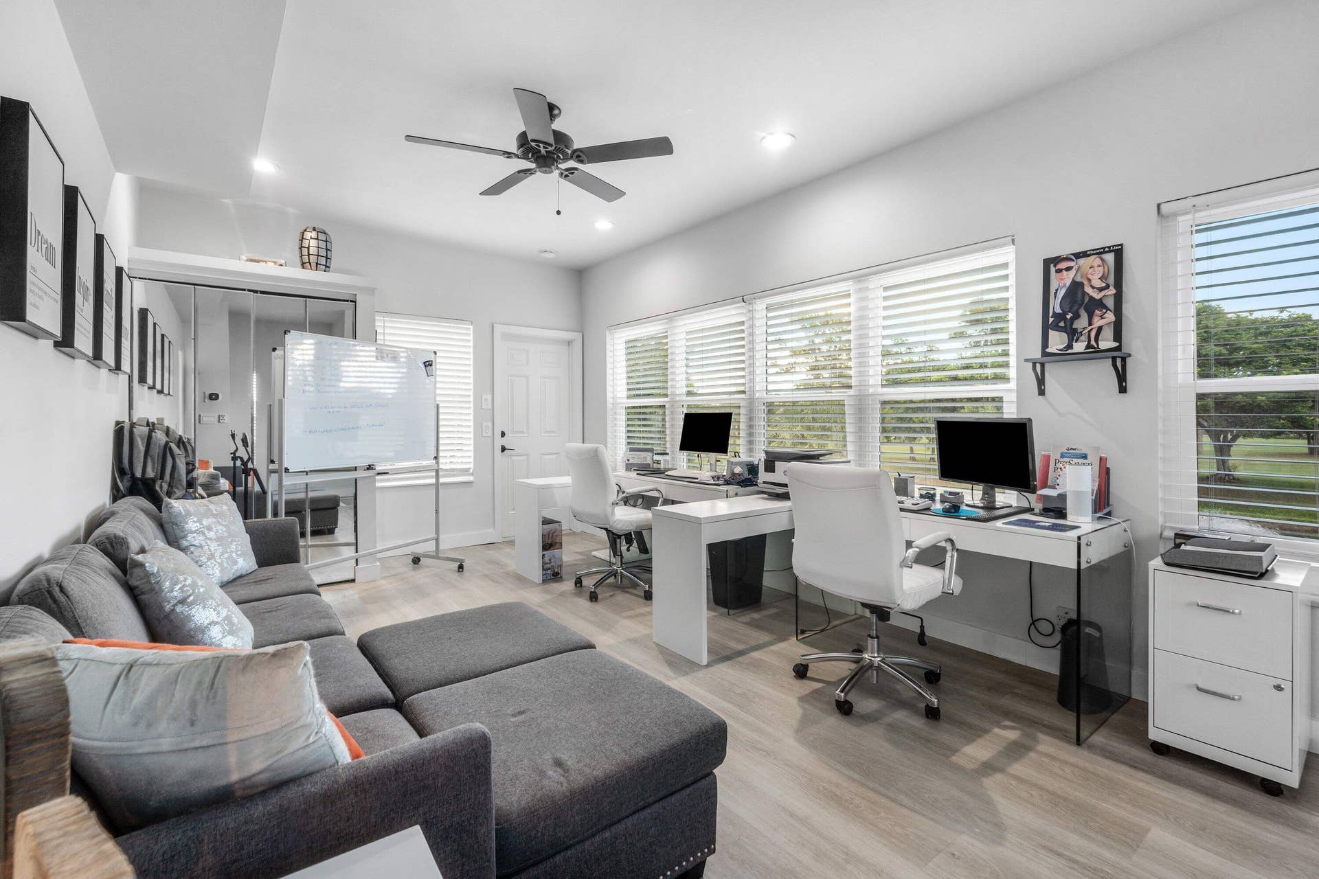 13138 Touchstone Place, Palm Beach Gardens, FL 33418 Spacious room with wood-finish flooring, multiple windows with blinds, a ceiling fan, and recessed lighting
