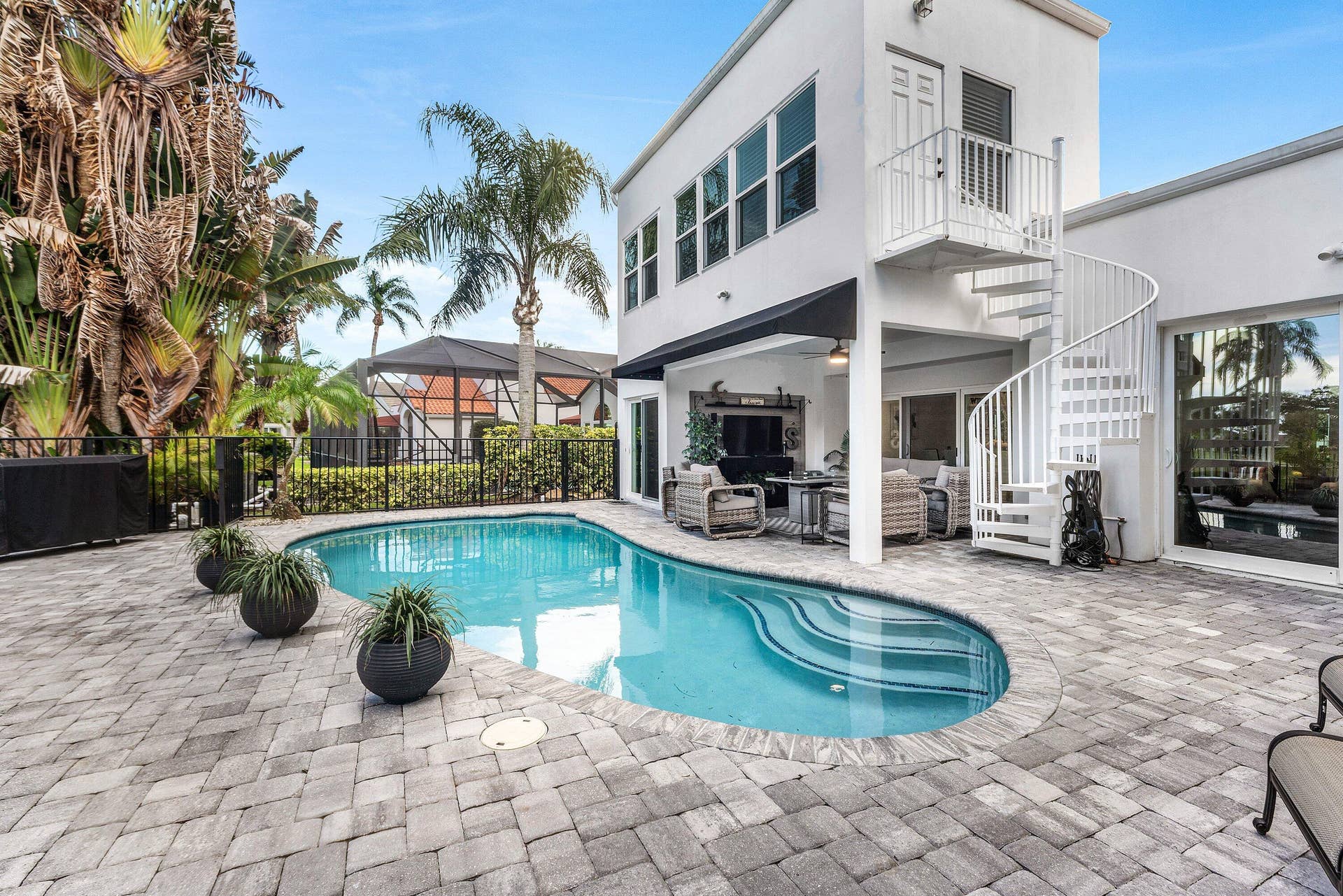 13138 Touchstone Place, Palm Beach Gardens, FL 33418 Outdoor pool with integrated steps, surrounded by a paver patio