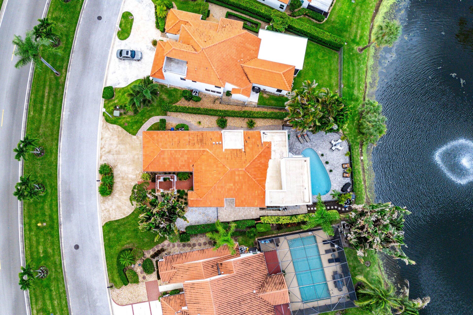 13138 Touchstone Place, Palm Beach Gardens, FL 33418 Property featuring a terracotta tile roof, private swimming pool, and dedicated patio area