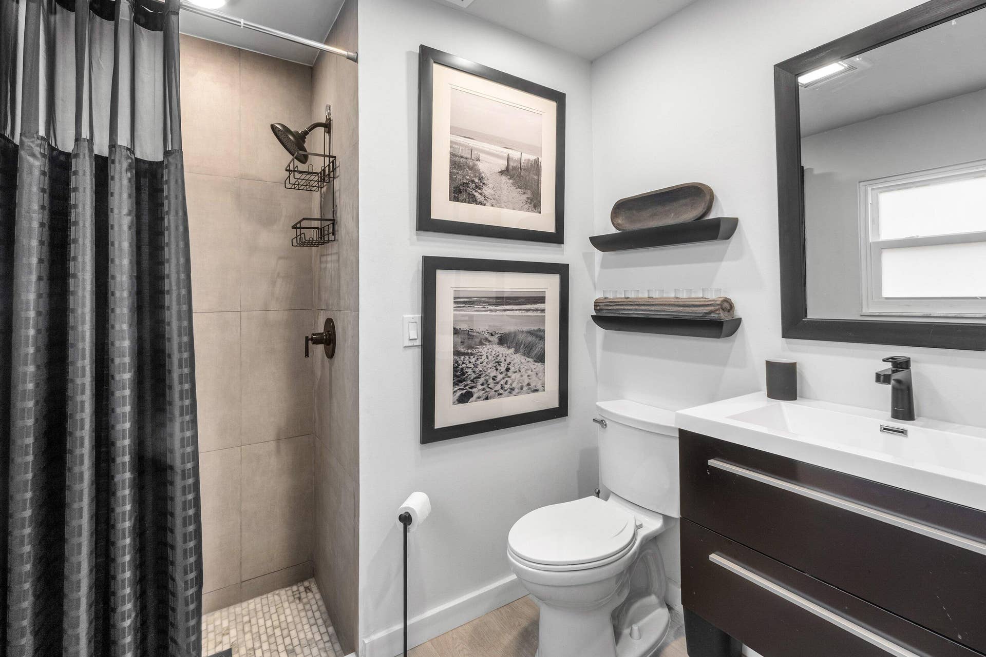 13138 Touchstone Place, Palm Beach Gardens, FL 33418 Shower with light-toned wall tile and pebble-style floor tile