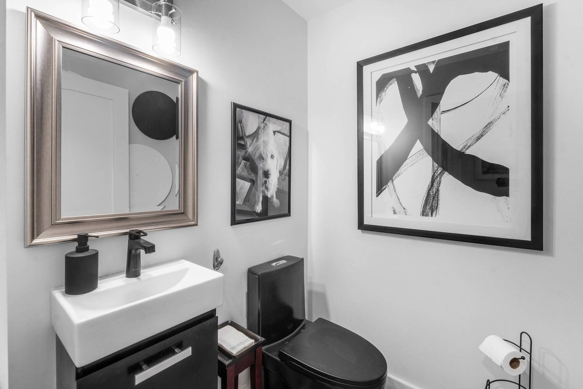 13138 Touchstone Place, Palm Beach Gardens, FL 33418 Wall-mounted vanity with a rectangular basin, matte black faucet, and coordinating mirror