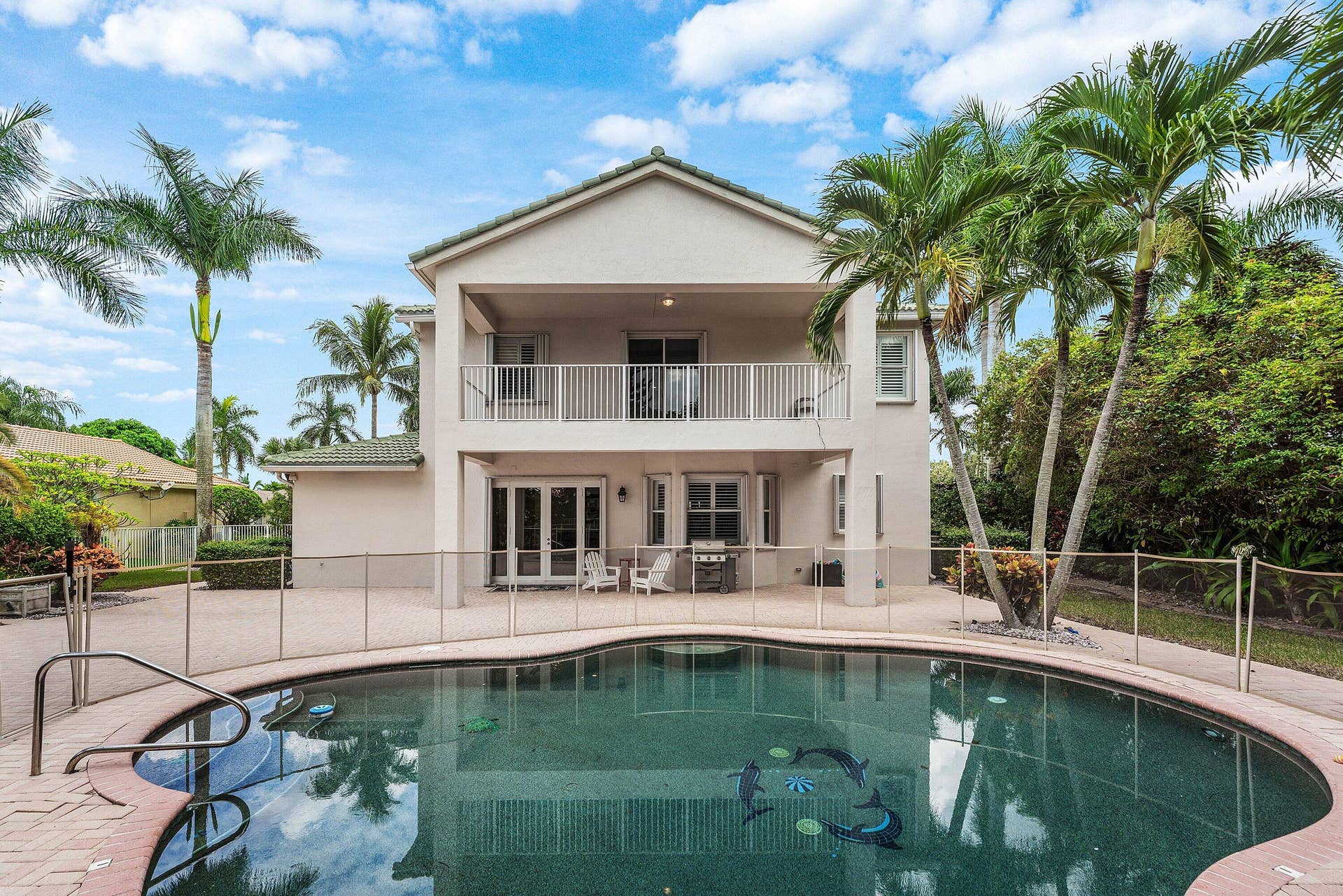 Large patio with private pool and lake views