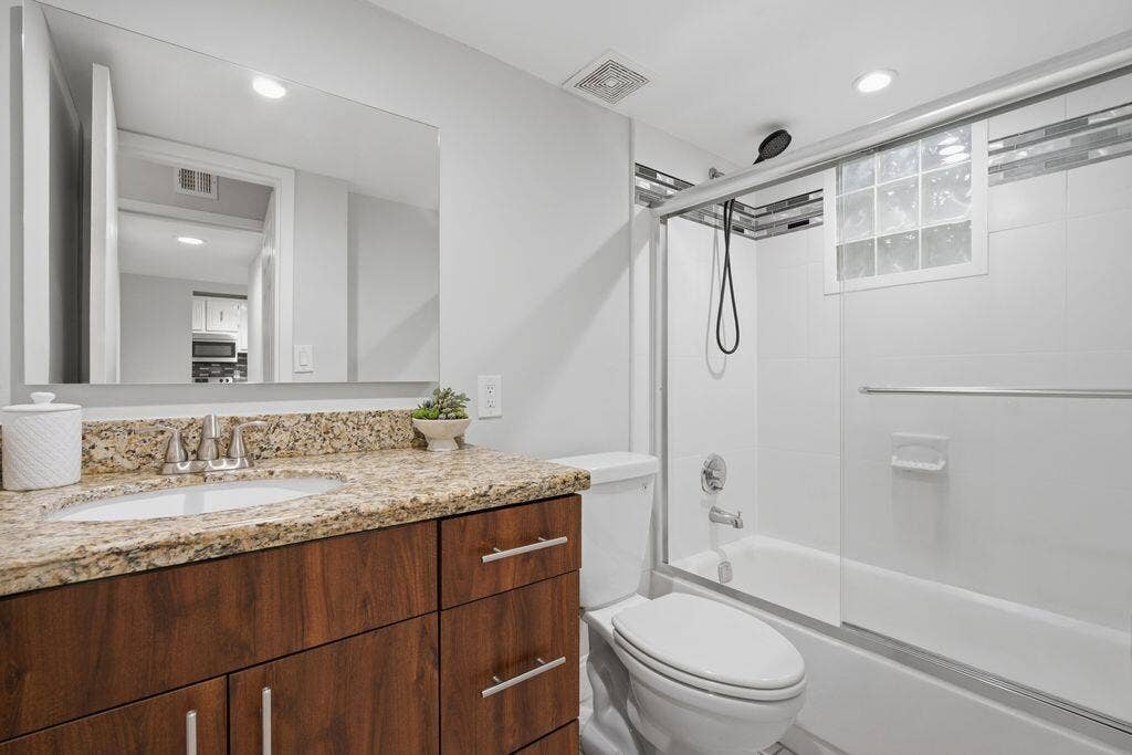 485 N PINE ISLAND Road, #A105, Plantation, FL 33324 Master bathroom with combo tub shower-glass door and marble updated high vanity