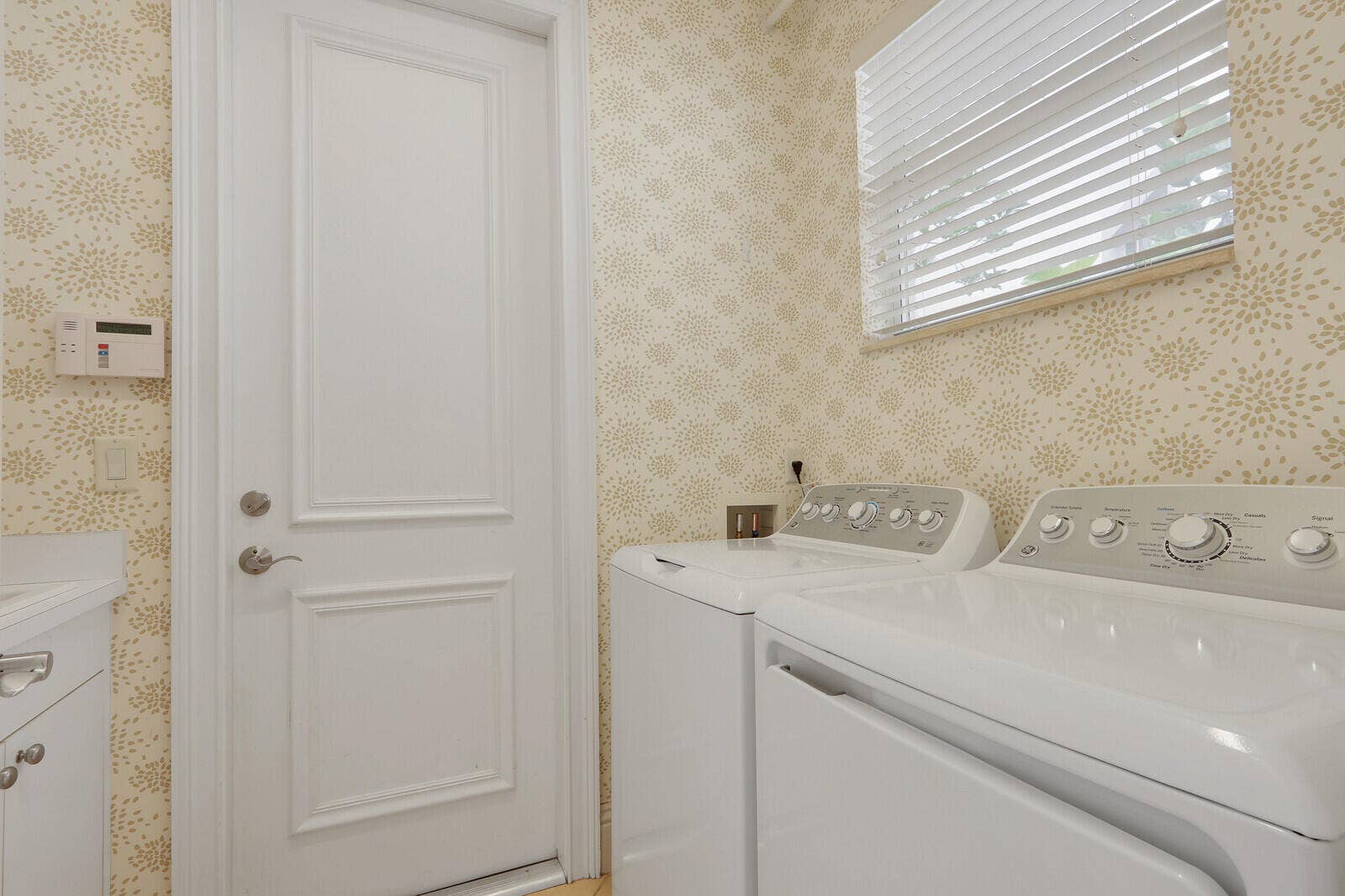 Dedicated laundry room w/laundry tub/cabinets overhead
