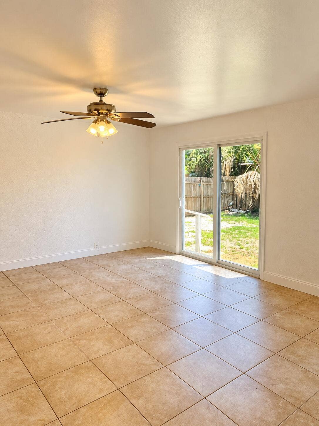 Bright Empty Room with Patio View