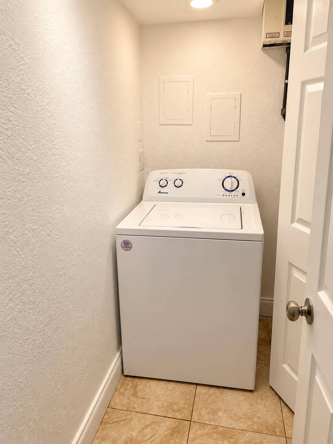 Bright Laundry Closet with Top-Loading W