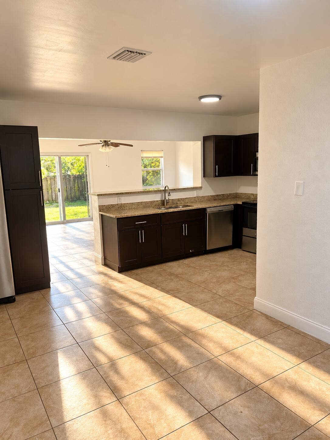 Sunlit Modern Kitchen and Living Space (