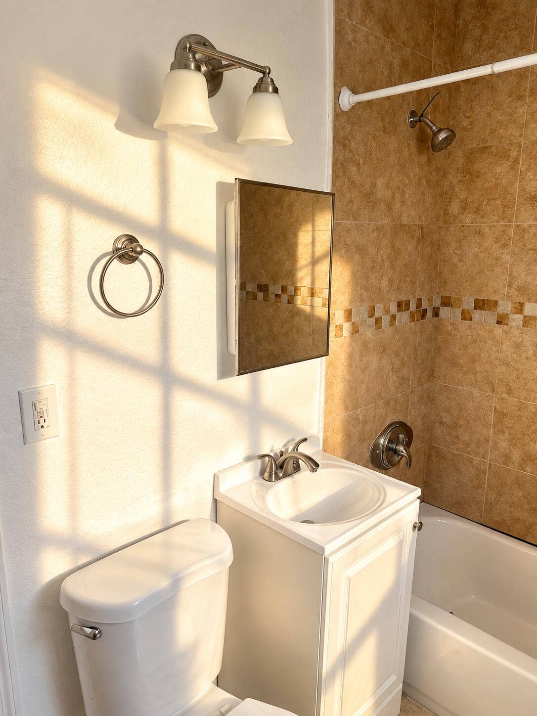 Sunlit Bathroom with Warm Tile Accents