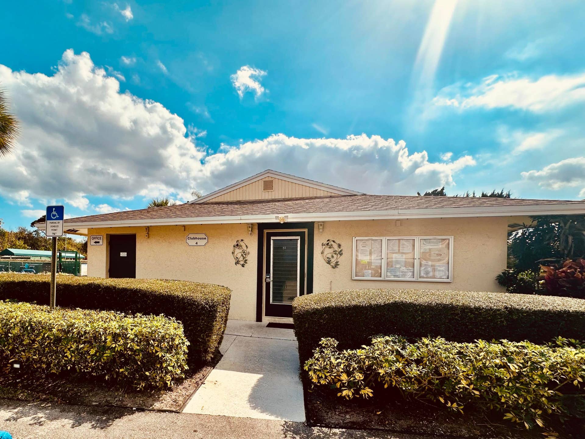 2950 SE Ocean Boulevard, #130-6, Stuart, FL 34996 Stucco exterior building with a gabled roof and brown shingles