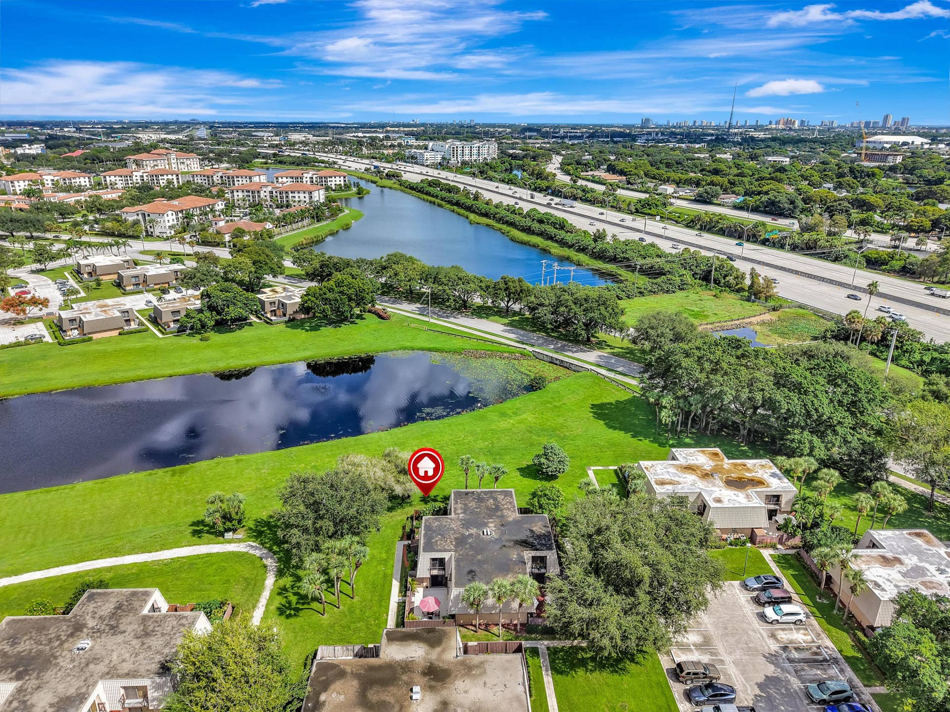 Aerial location of property facing water and aerial view of Downtown West Palm Beach in distance