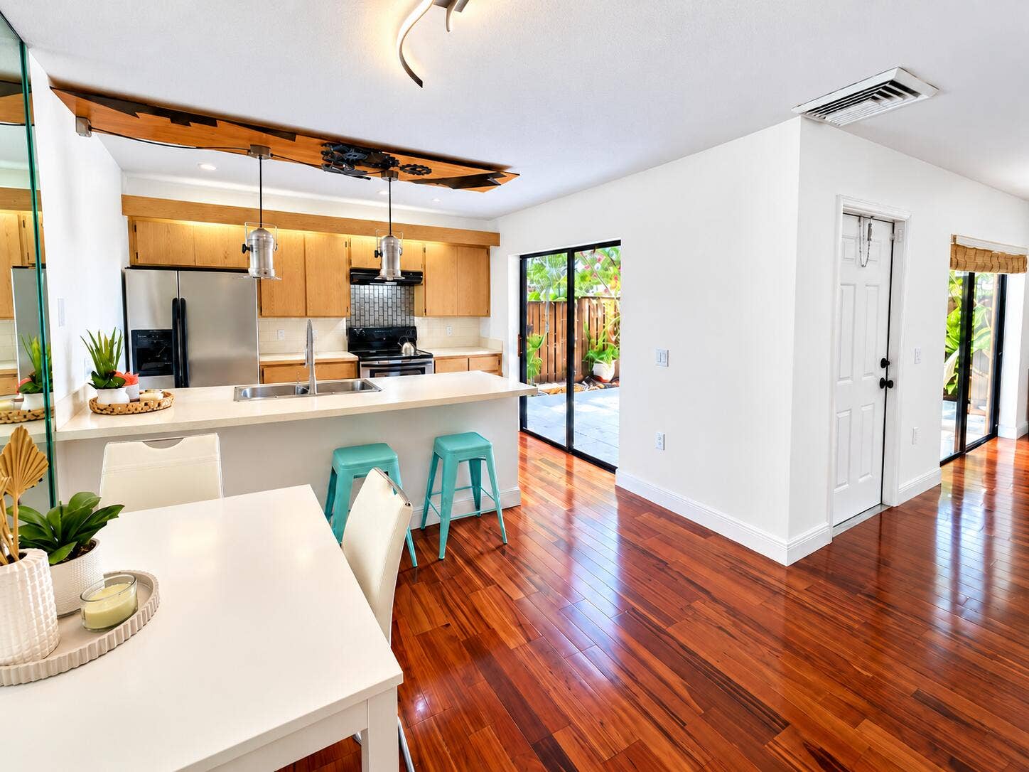 Dining view open to kitchen with patio view