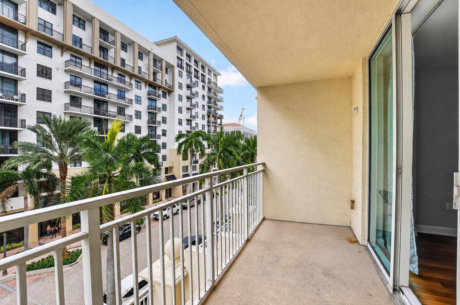 99 SE Mizner Boulevard, #435, Boca Raton, FL 33432 Sunlit Balcony Overlooking Palm-Lined Re