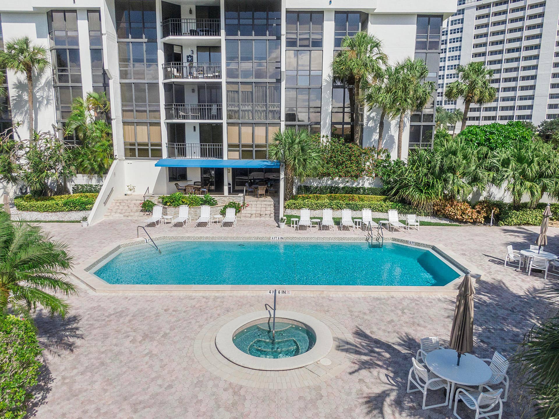 1901 S Ocean Boulevard, #401, Boca Raton, FL 33432 Well maintained pool deck with hot tub and plenty of chairs