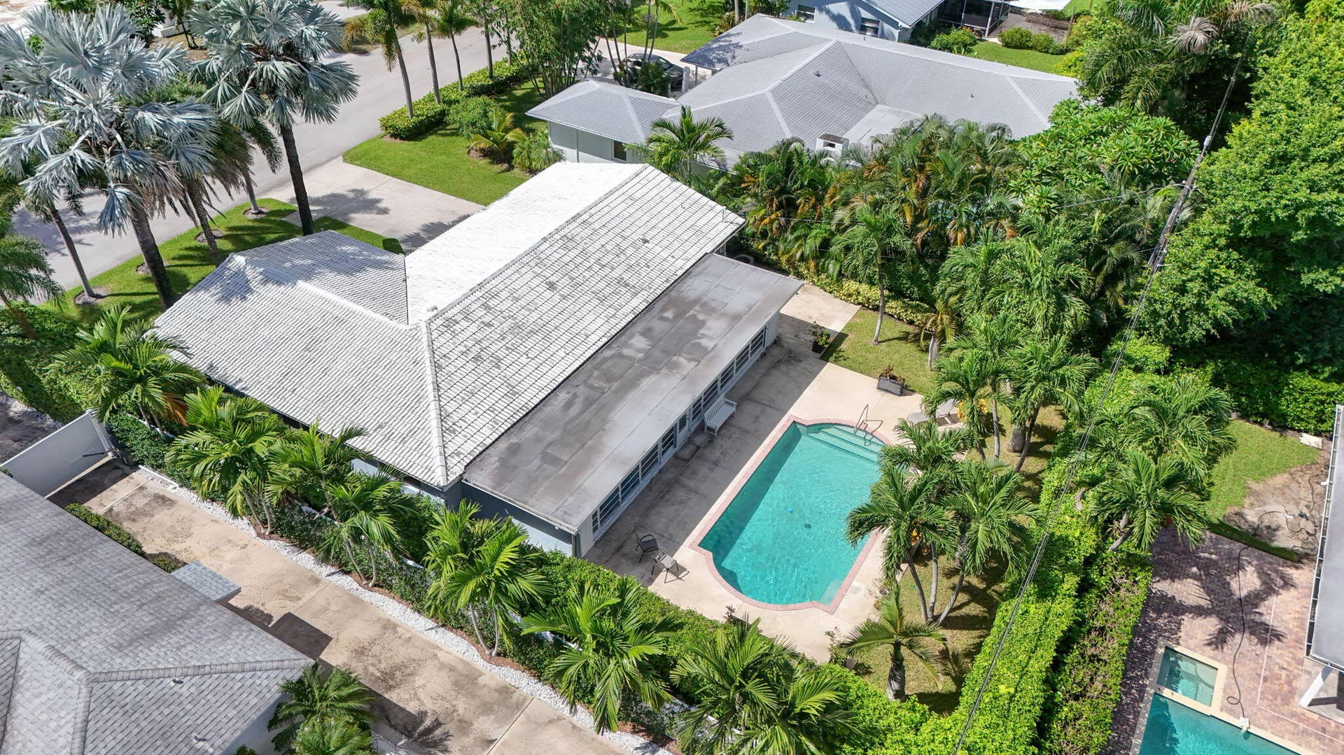 128 VASSAR Drive, Lake Worth Beach, FL 33460 75-web-or-mls-DJI_20261007235137_0348_D-