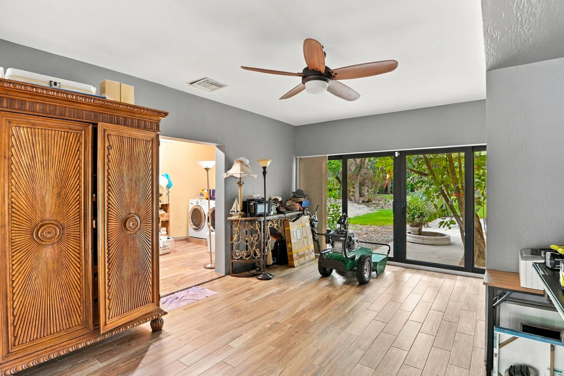 1549 SW 30th Place, Fort Lauderdale, FL 33315 Wood-finish flooring throughout, with a ceiling fan overhead