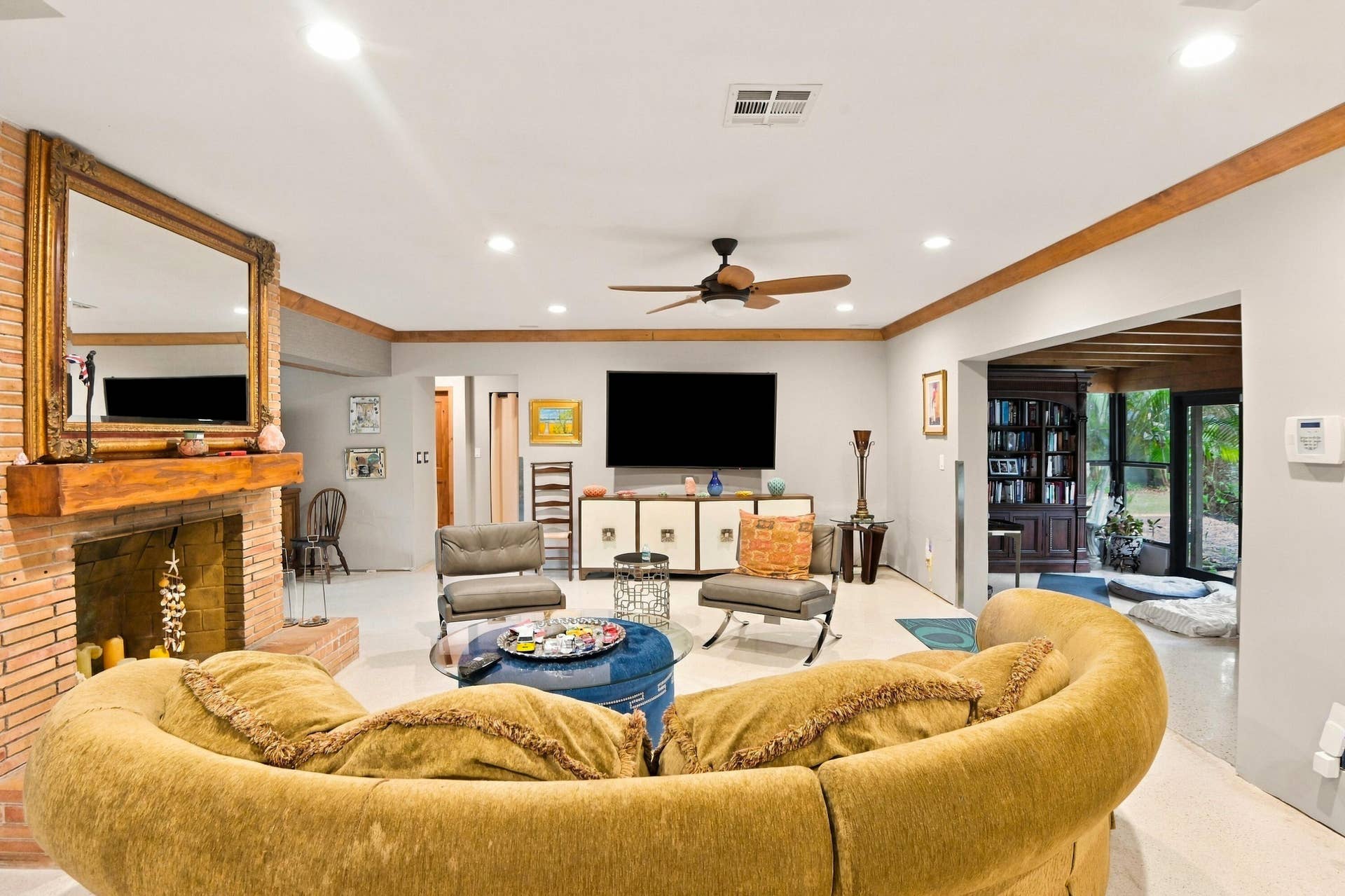 1549 SW 30th Place, Fort Lauderdale, FL 33315 Living area featuring a brick fireplace with a wood mantel, recessed lighting, and a ceiling fan