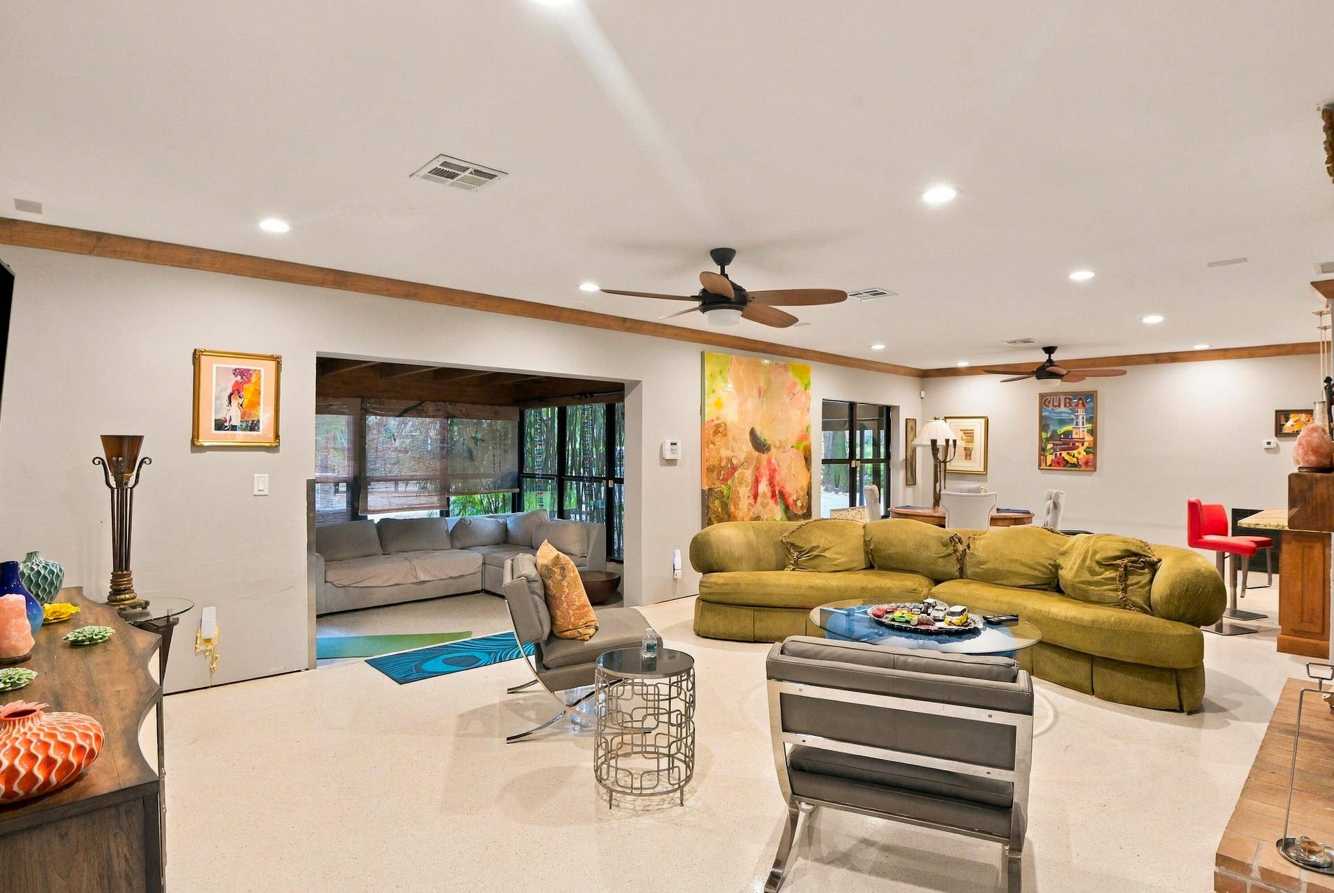 1549 SW 30th Place, Fort Lauderdale, FL 33315 Spacious room featuring light-toned flooring, recessed lighting, and exposed wood ceiling beams