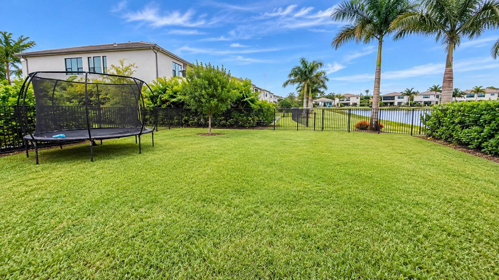20050 Hirono Lane, Boca Raton, FL 33434 Sunny Waterfront Backyard with Trampolin