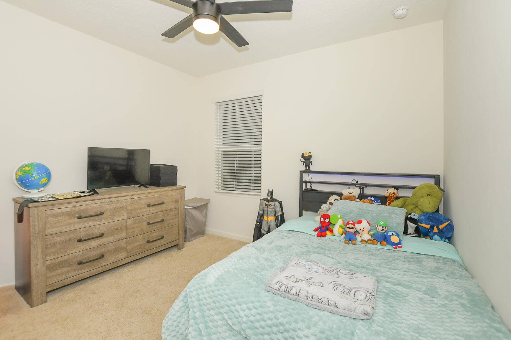 carpet and fan in bedroom