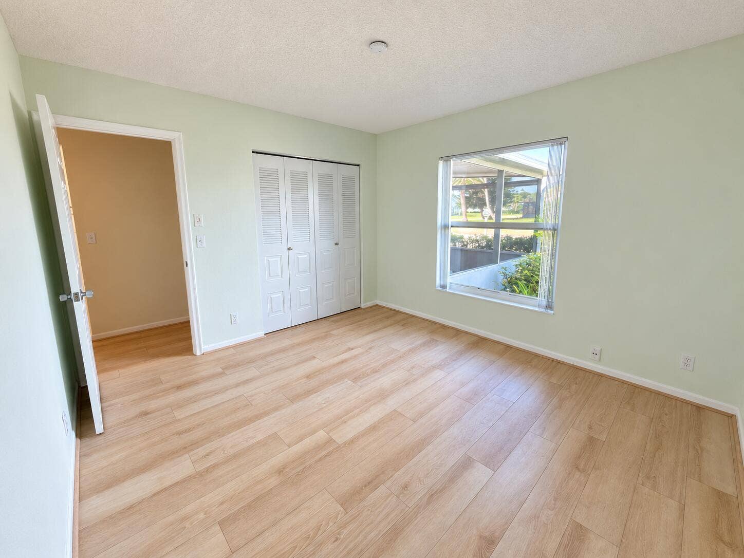 Brightened mint bedroom, clutter-free co