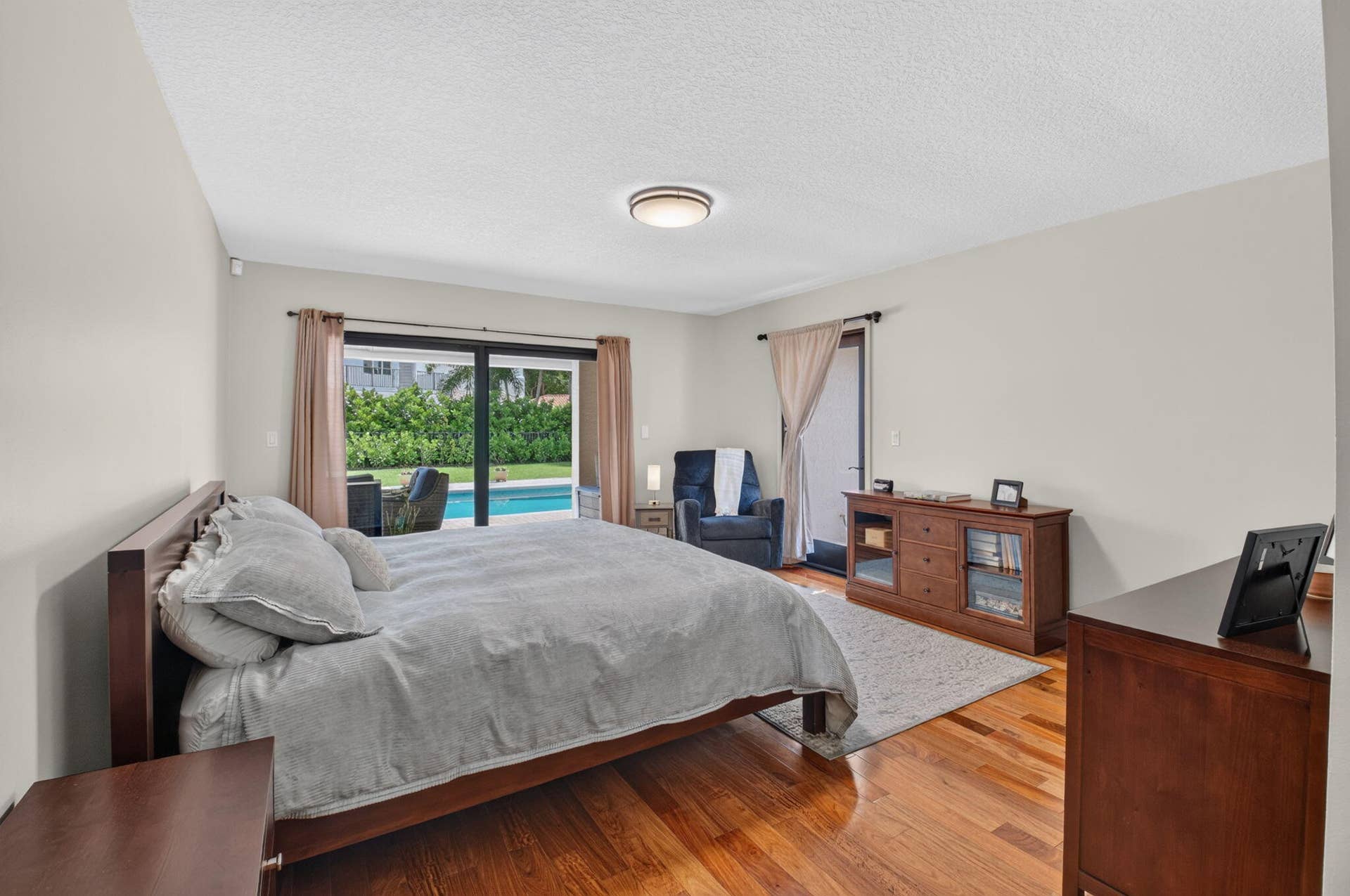 Primary bedroom overlooking the pool