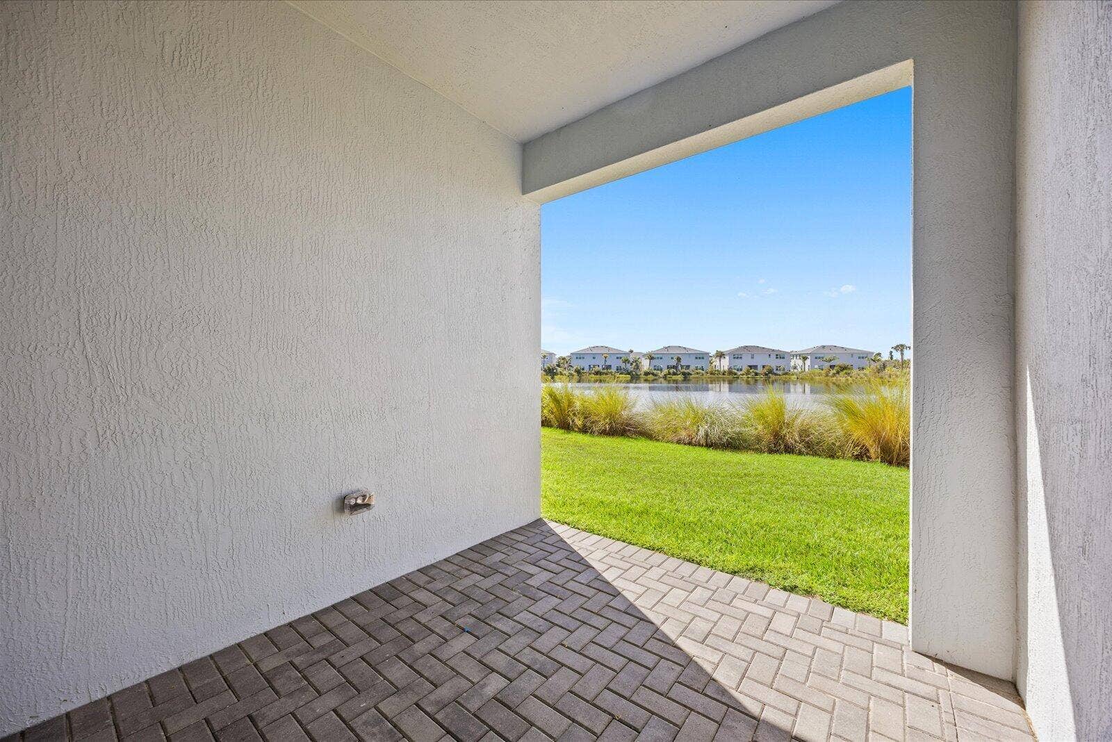 3566 NW SOLANGE Court, Jensen Beach, FL 34957 Covered Lanai with water view!