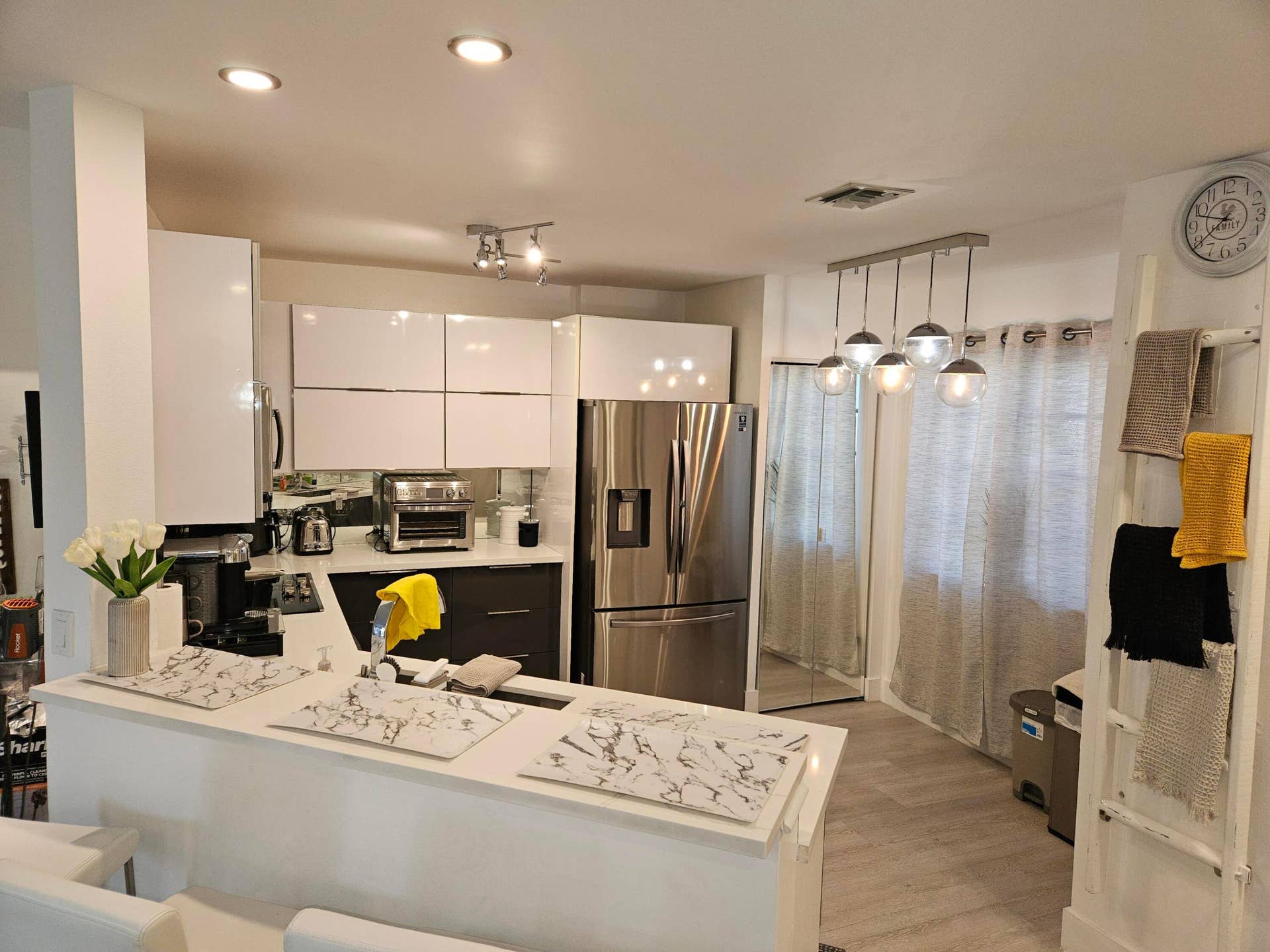1460 SW 47TH Avenue, #1460, Deerfield Beach, Deerfield Beach, FL 33442 White kitchen island with a built-in sink, white shaker-style cabinetry, stainless steel refrigerator, and recessed lighting