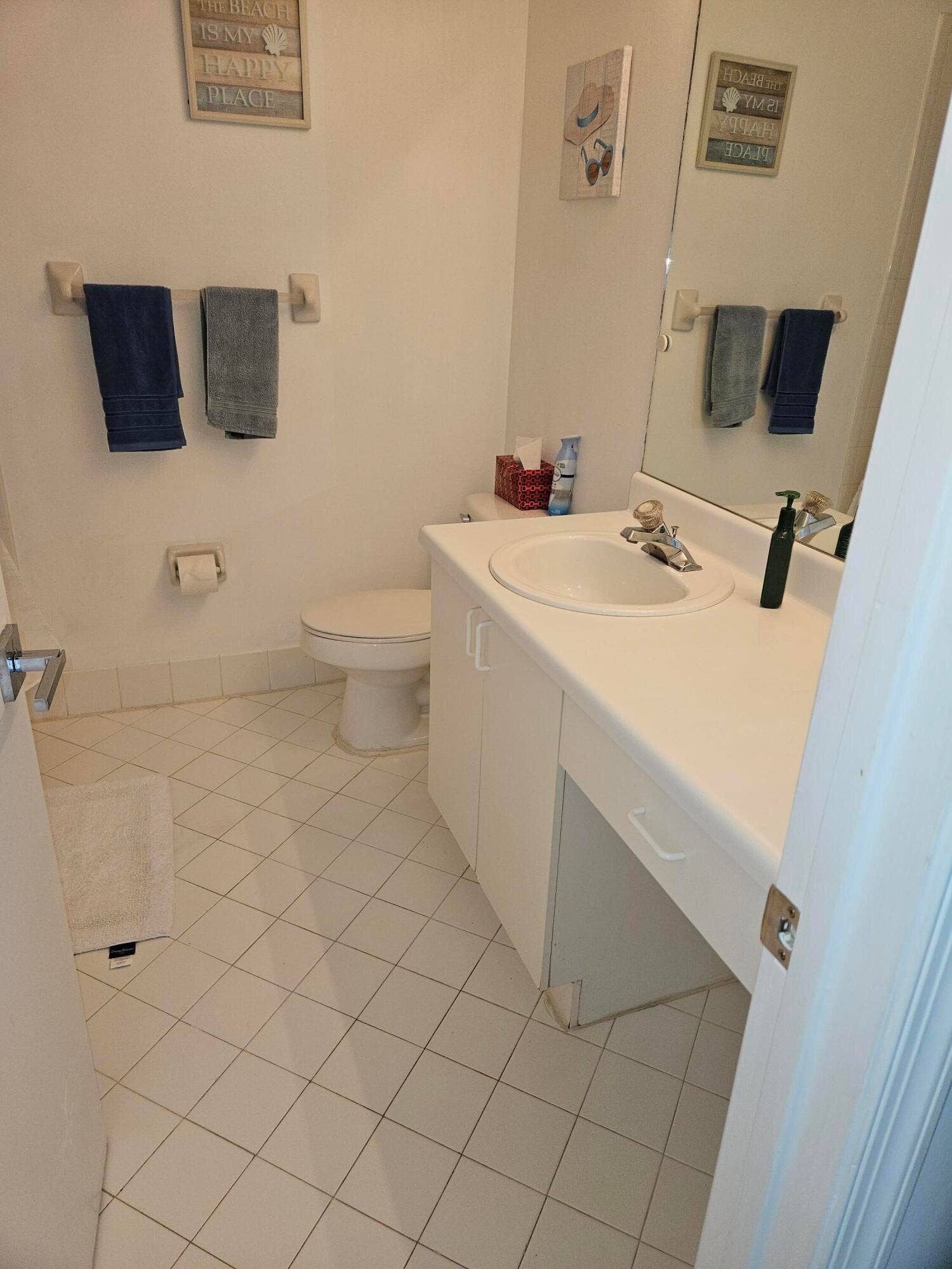 1460 SW 47TH Avenue, #1460, Deerfield Beach, Deerfield Beach, FL 33442 White tile flooring, single vanity with integrated sink, wall-mounted mirror, and white toilet