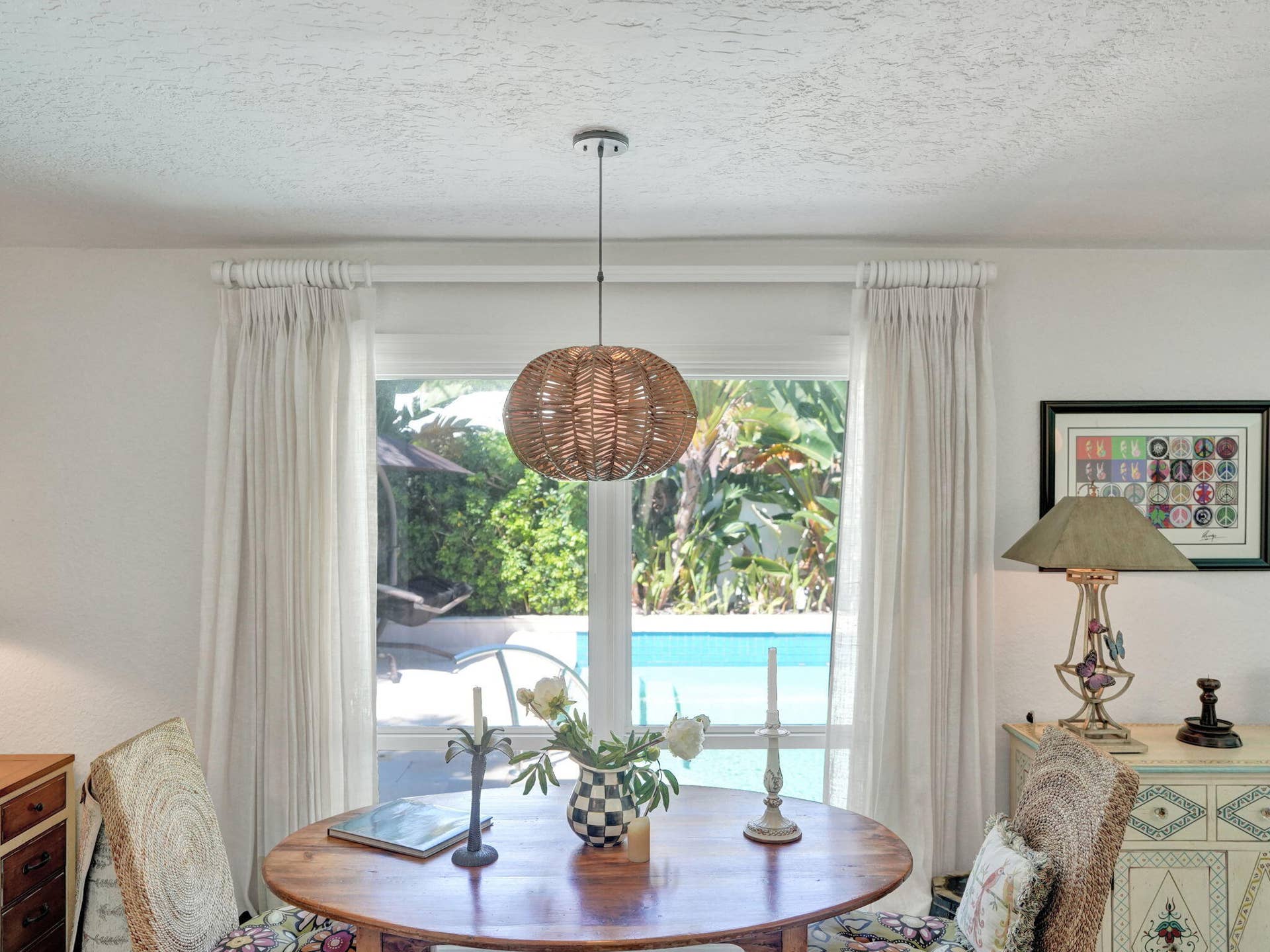 Casual Breakfast area/office space overlooks pool and mature landscaping.