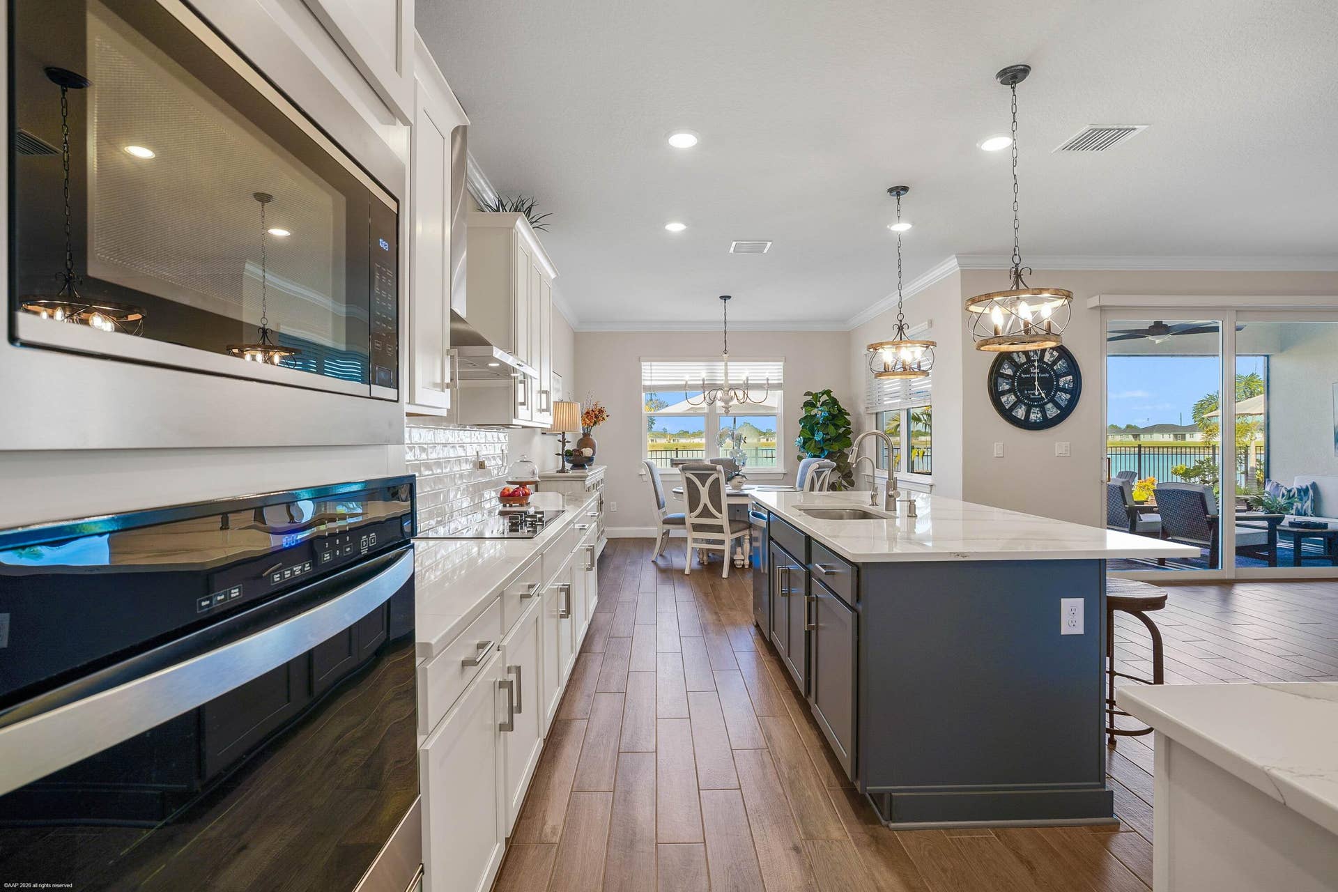 Kitchen with wall ovens and open view to the great room